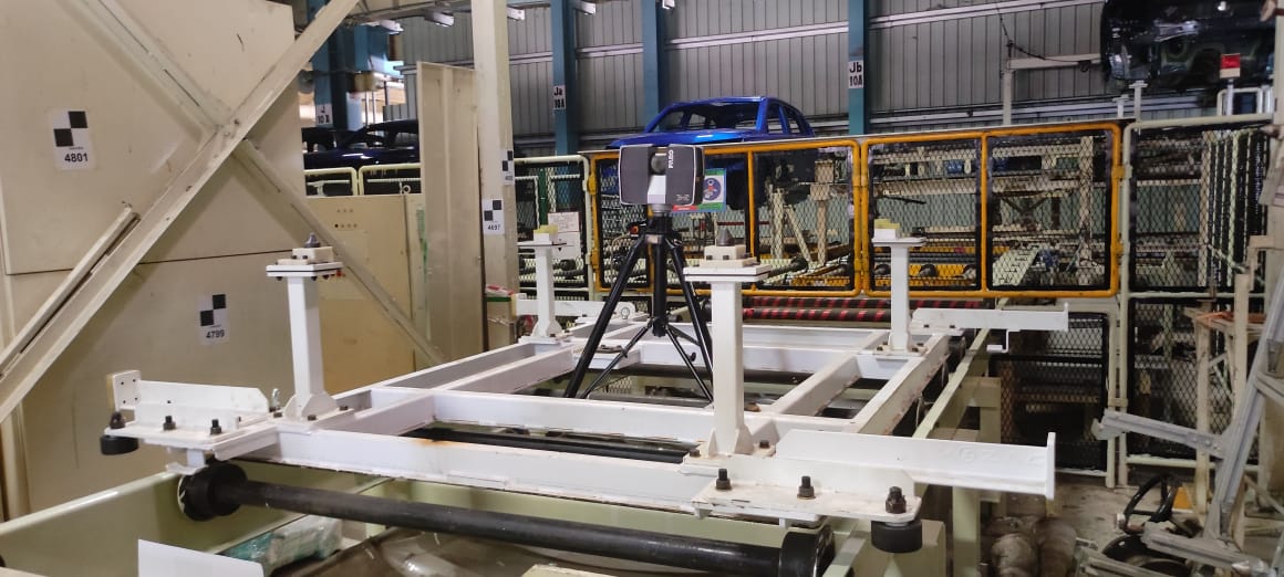 person holding green and black circuit board