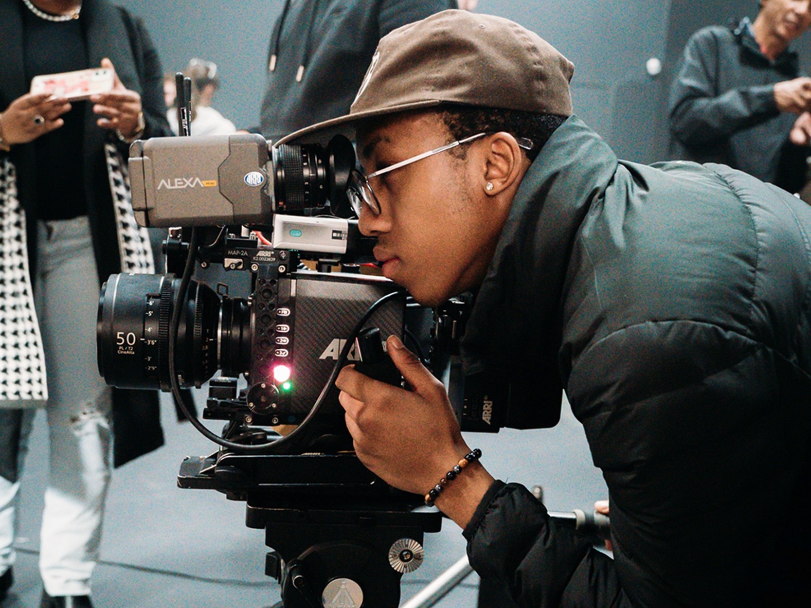 man in white button up shirt holding white smartphone