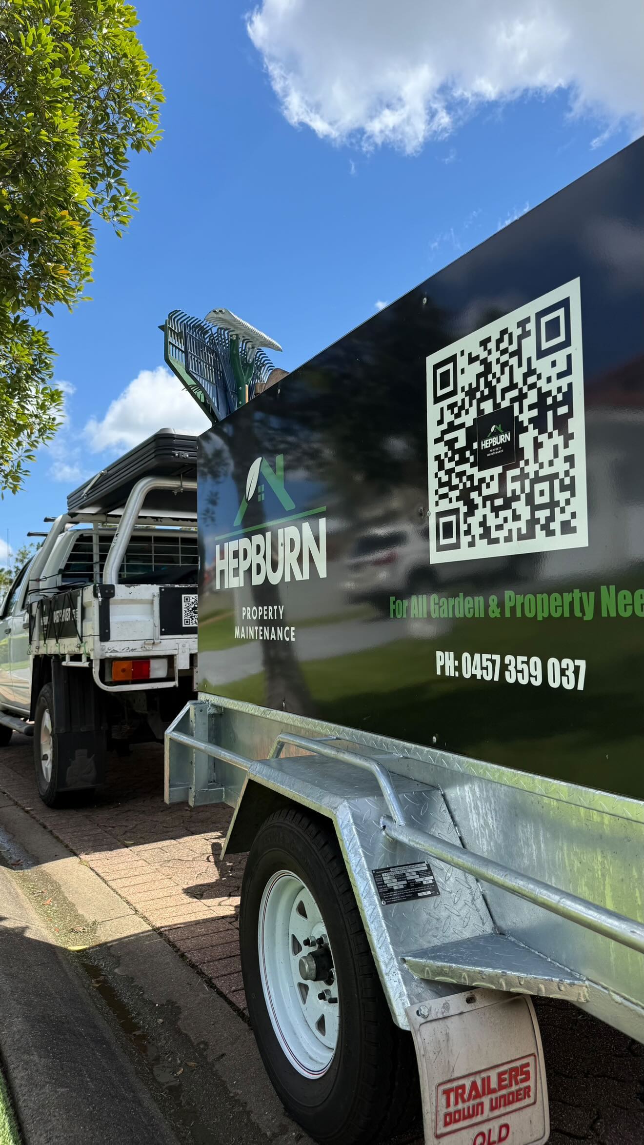 Hepburn Property Maintenance branded trailer and ute loaded with equipment ready for lawn mowing and garden maintenance Gold Coast