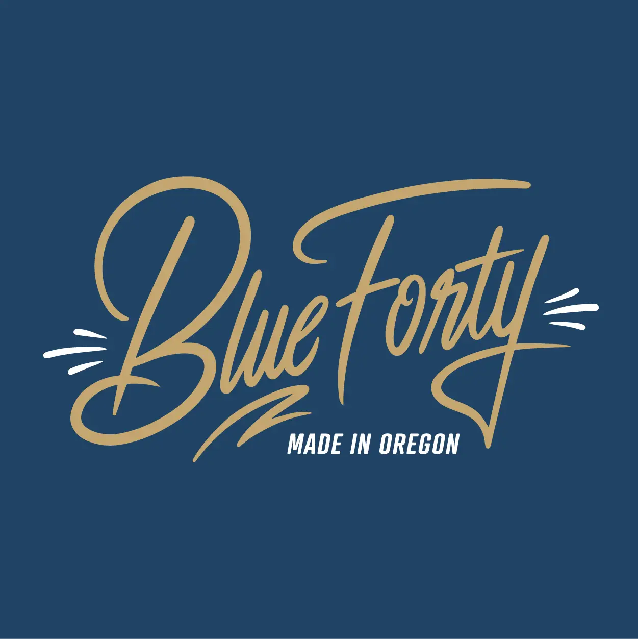 Blue Forty written in smooth gold handwritten script, with lines varying from thick to thin forming sharp points.