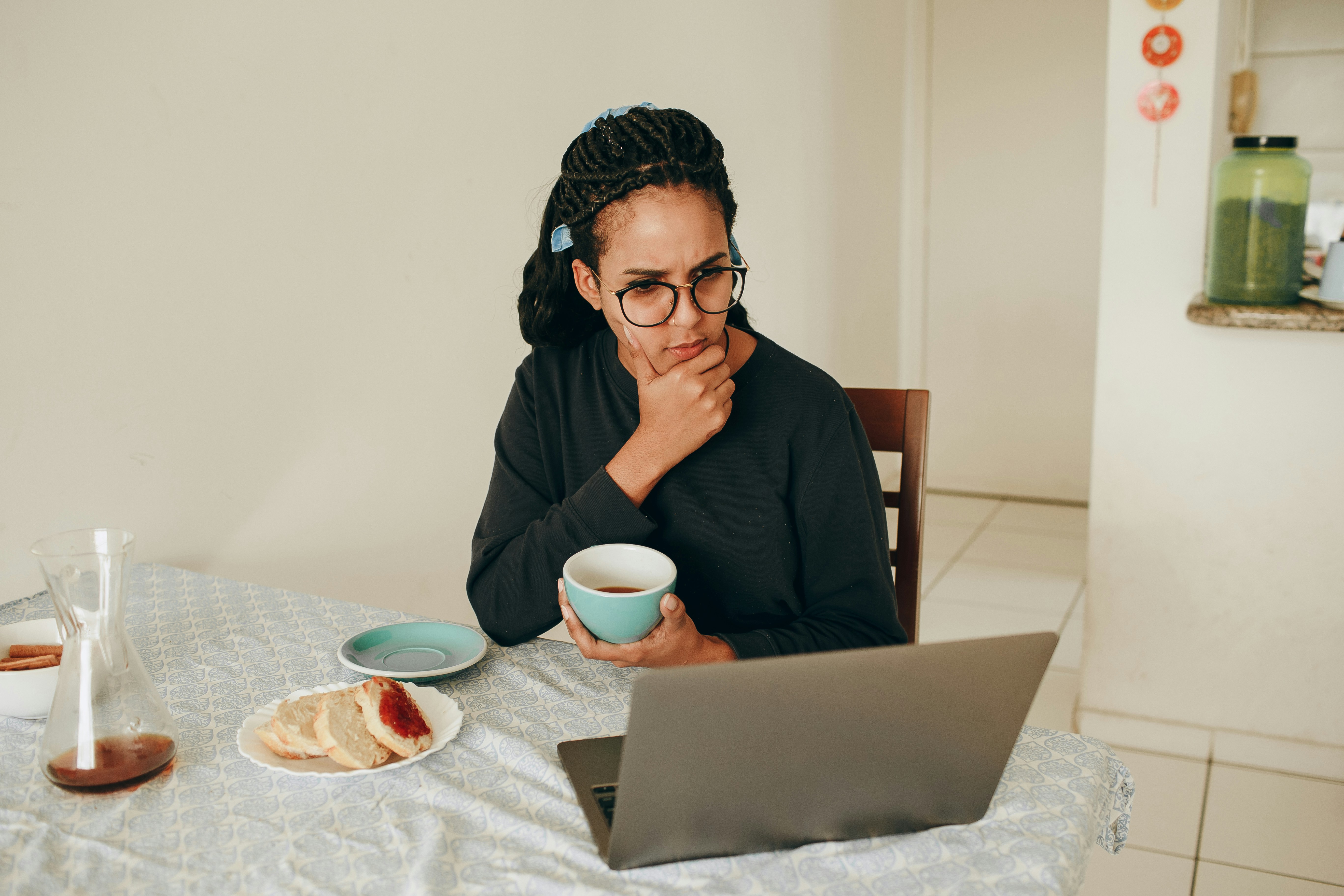 woman in black long sleeve shirt wearing black framed eyeglasses