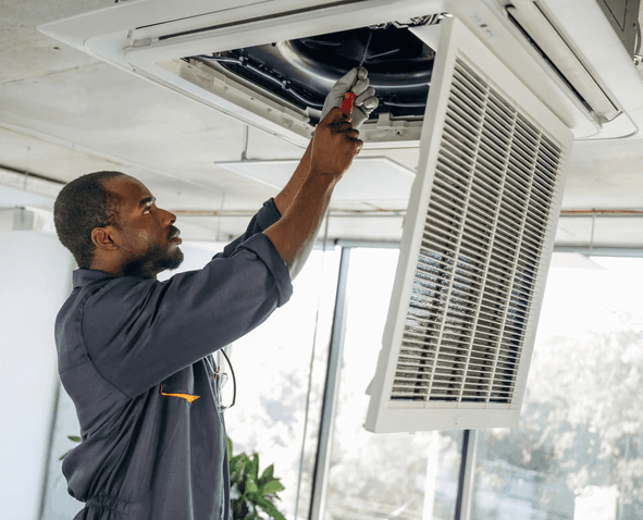 HVAC technician installing outdoor AC unit for residential HVAC services in East York