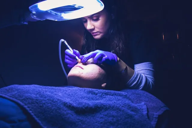 Woman receiving microdermabrasion