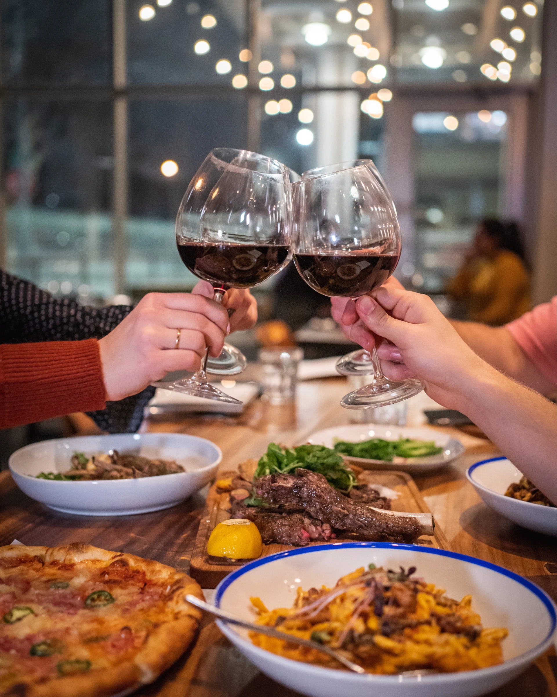 People having fun drinking wine in an Italian restaurant