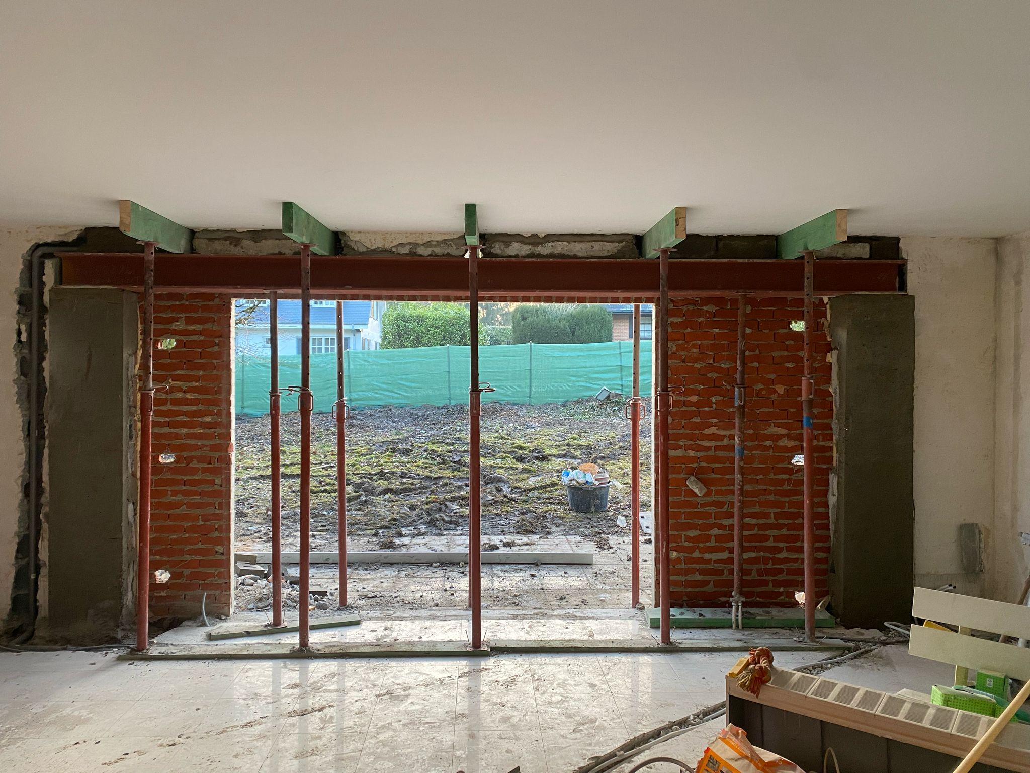 a brick wall with a wooden door in it