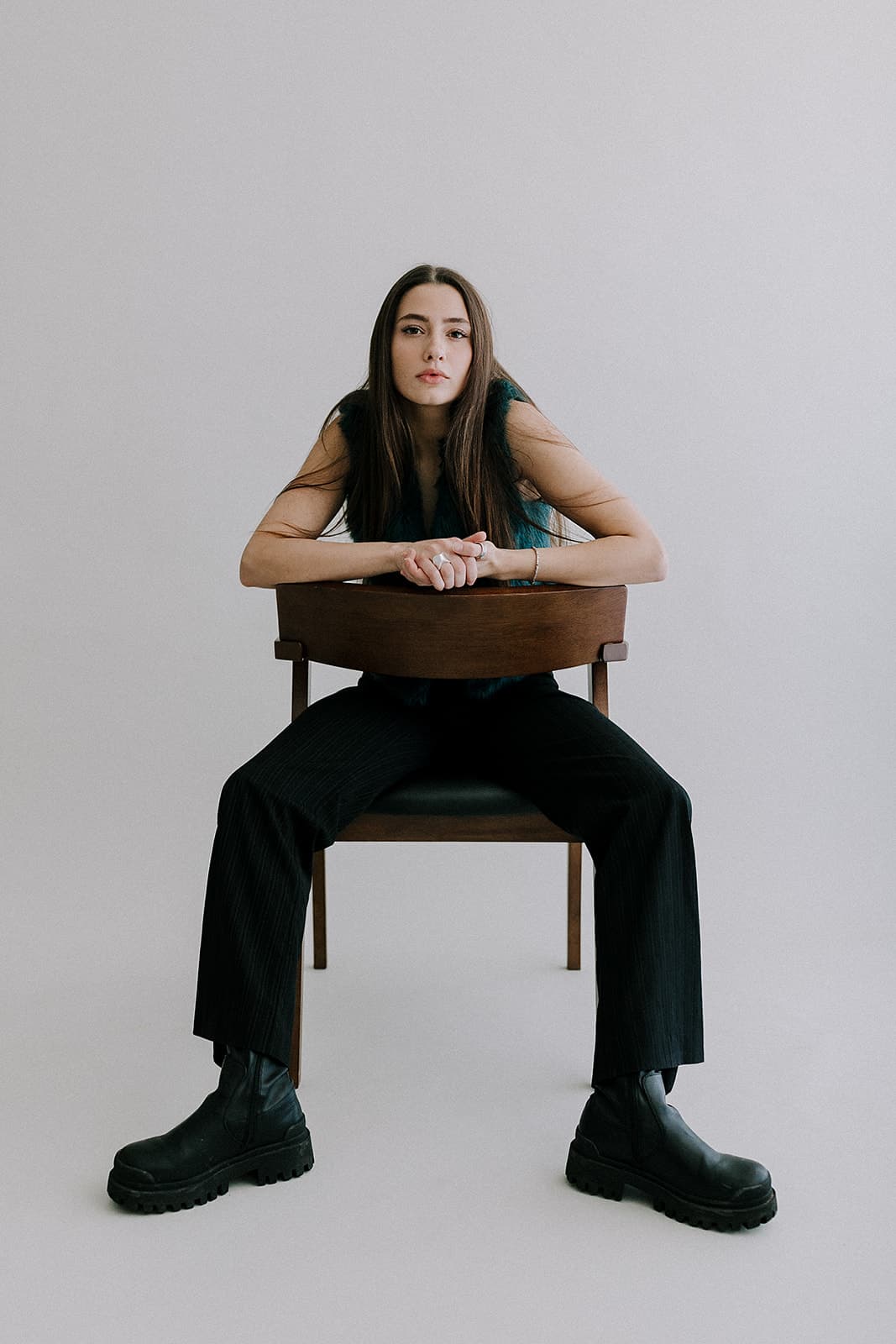 Woman sitting backwards on a chair