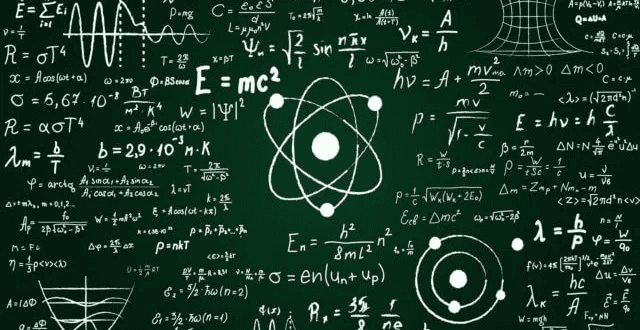 High school student studying physics research data on a laptop with physics equations on a whiteboard in the background