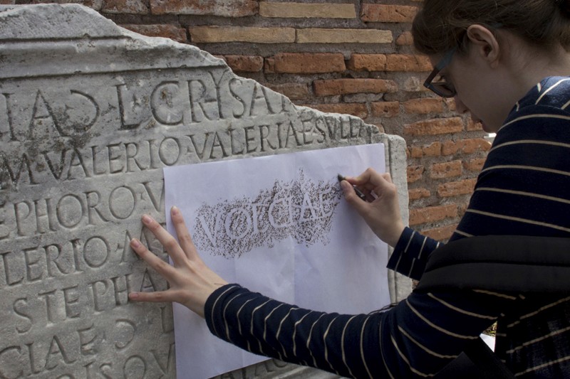 a woman making type trace