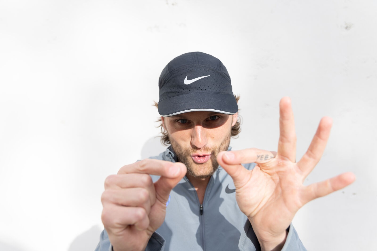 Nike shoot, an athlete in a cap, playing to the camera