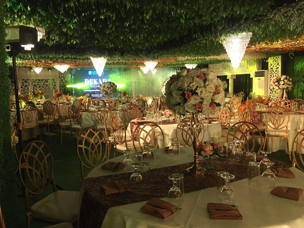 Corporate event reception with gold accents at Pandora Hall, Stalla Suites QC