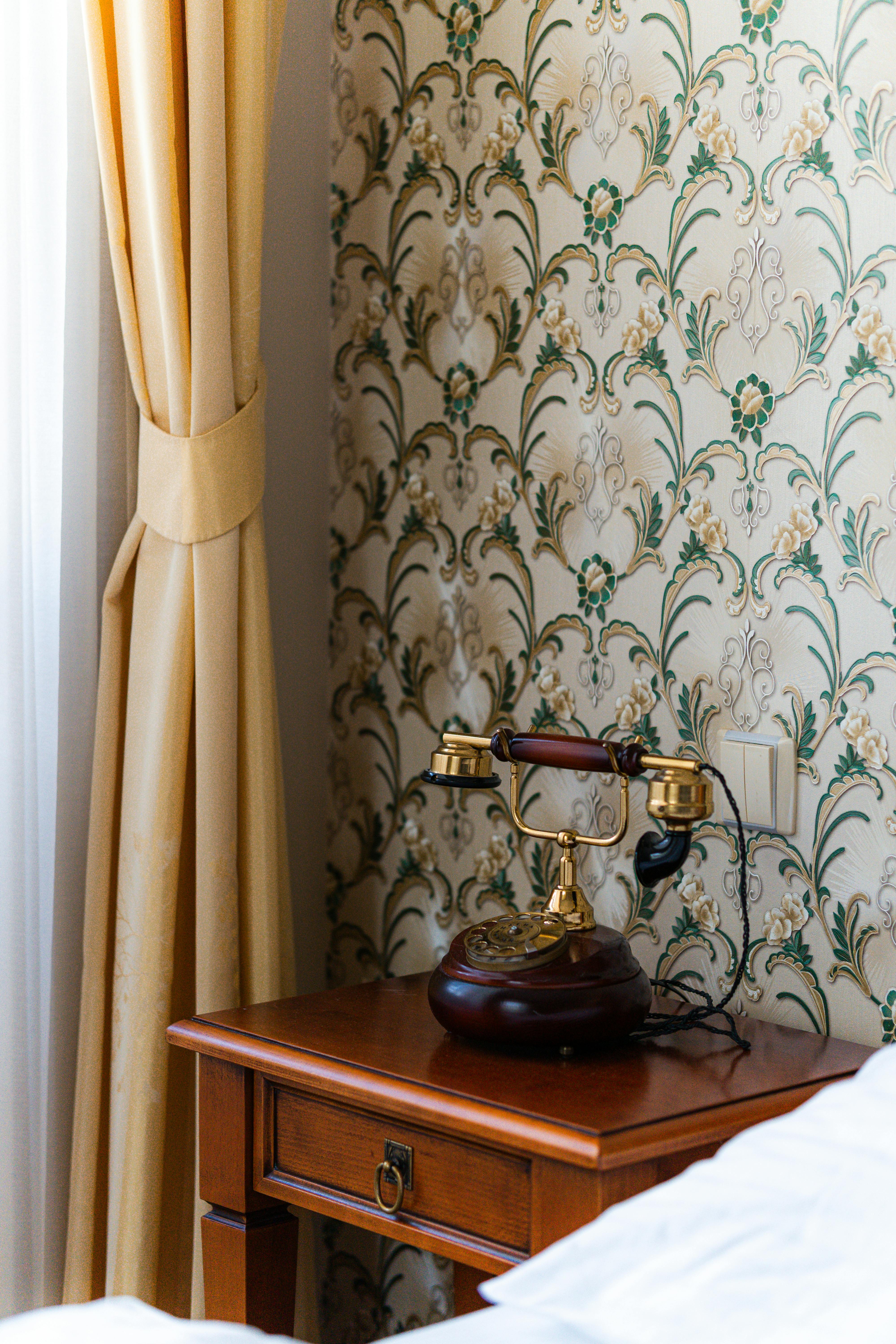 A traditional dining hall with classic red dining chairs and elegant interiors.