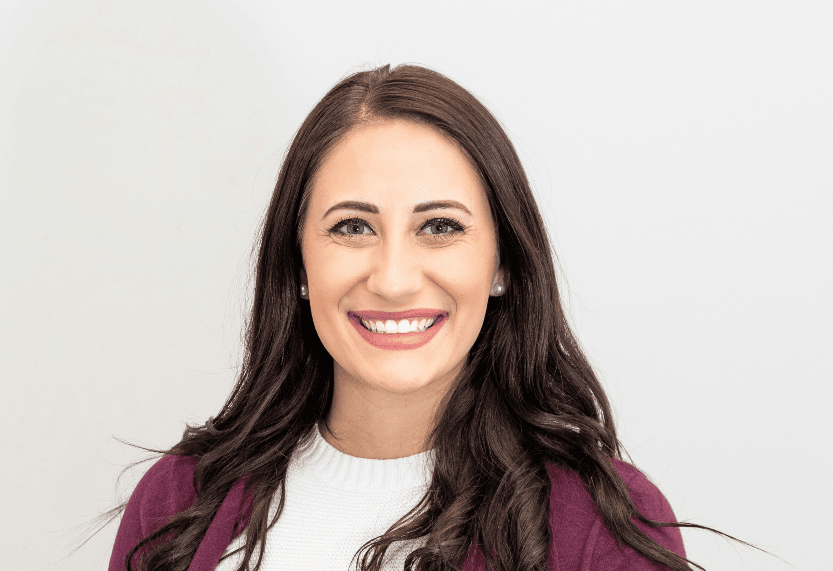 woman in red cardigan smiling