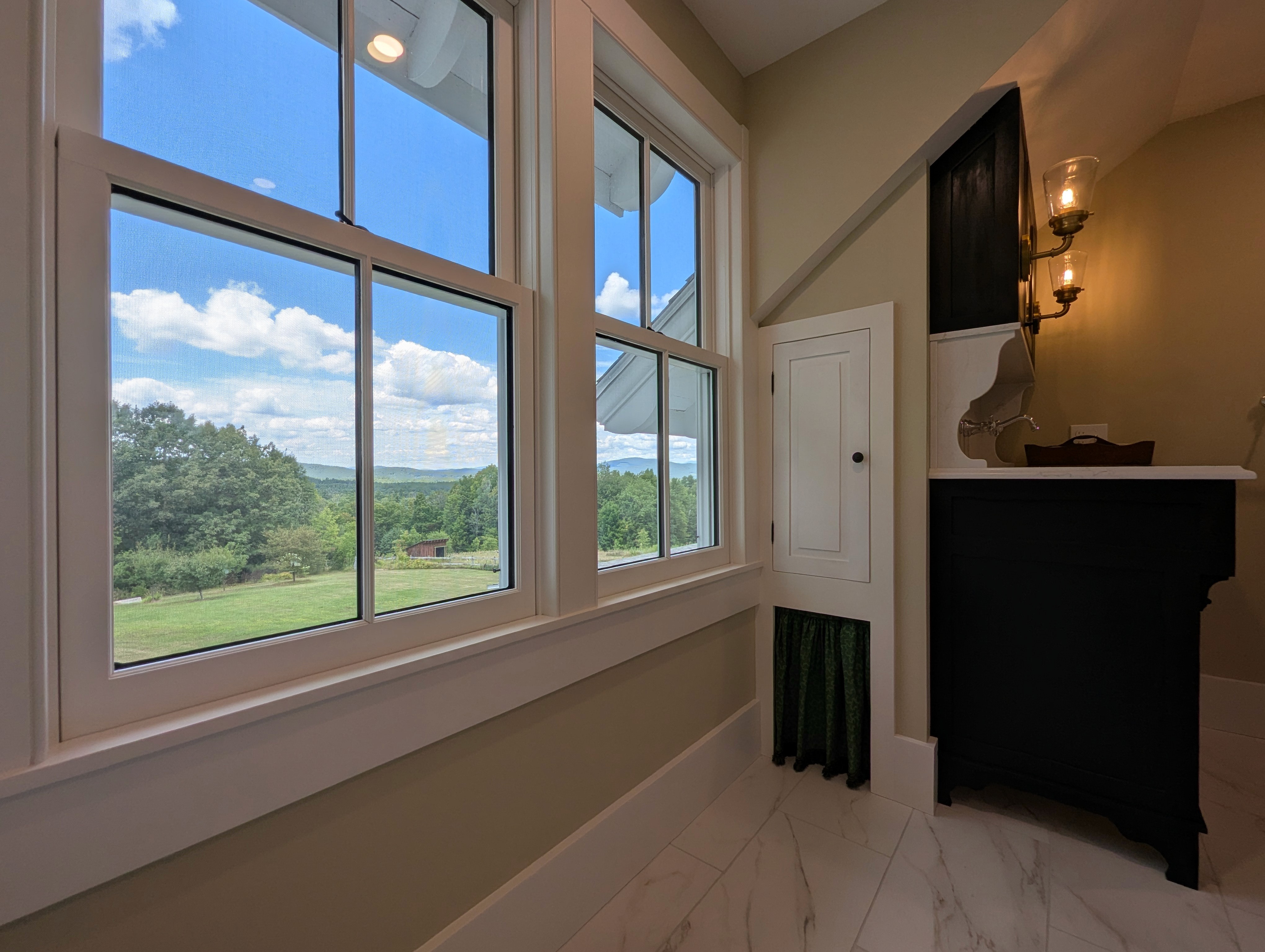 bathroom windows with the side of a custom vanity