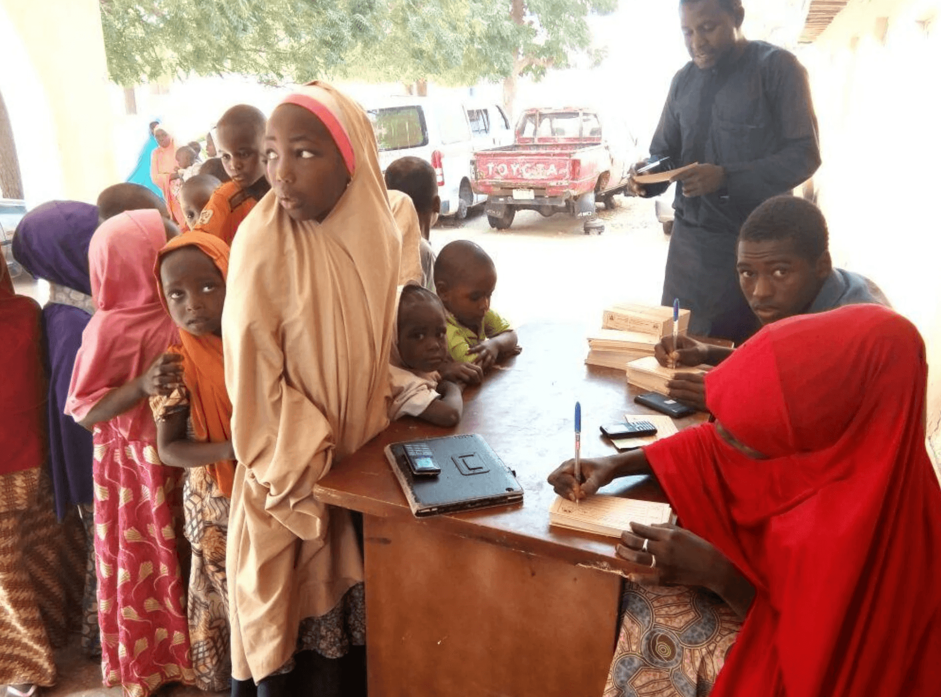 girl in white and pink dress with face mask