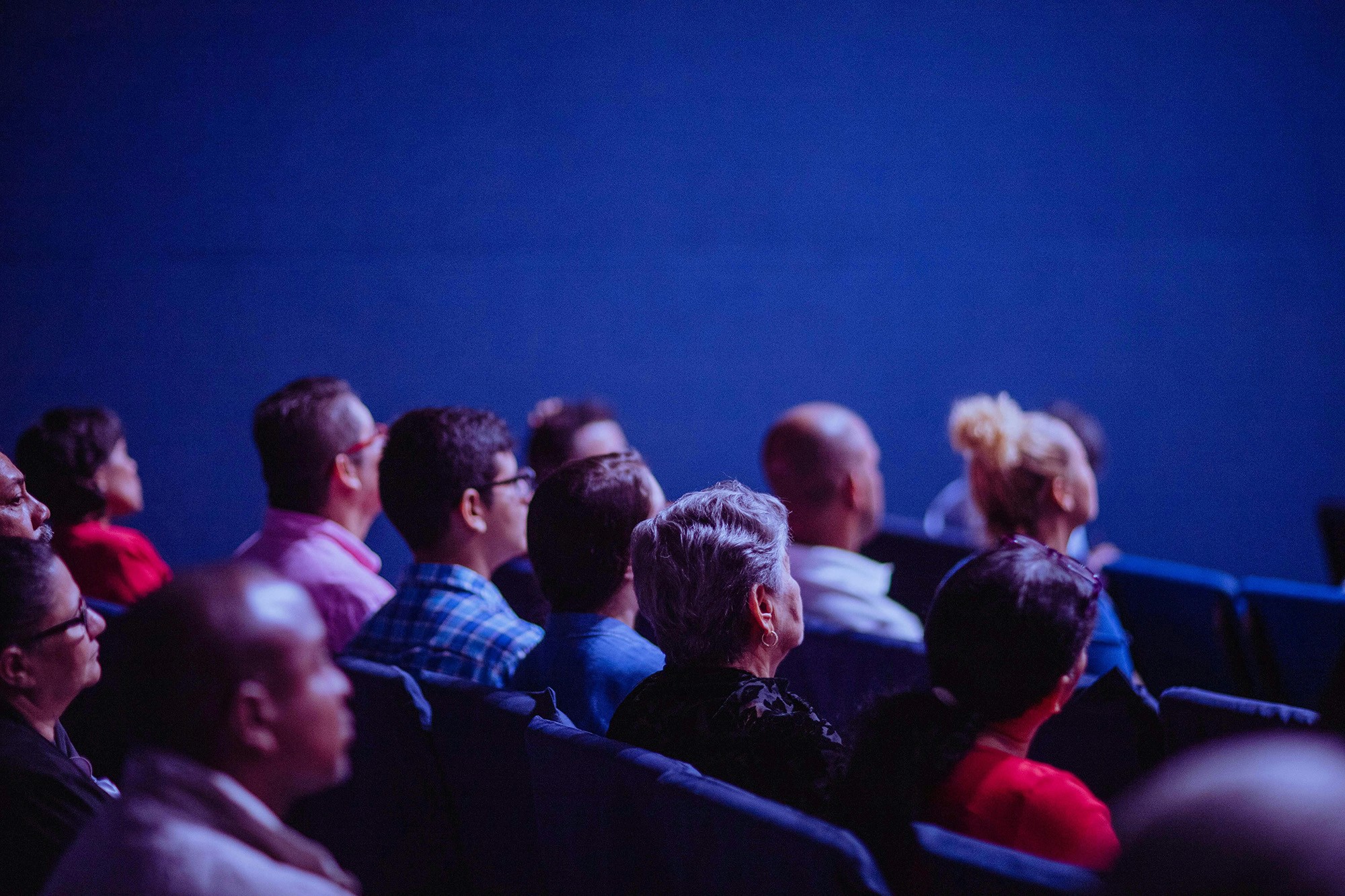 People sitting and listening to a speaker