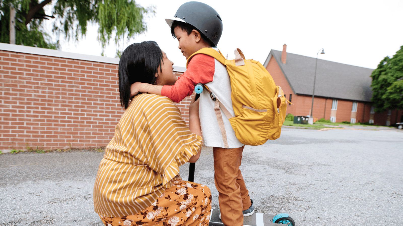 Mother dropping off child at school