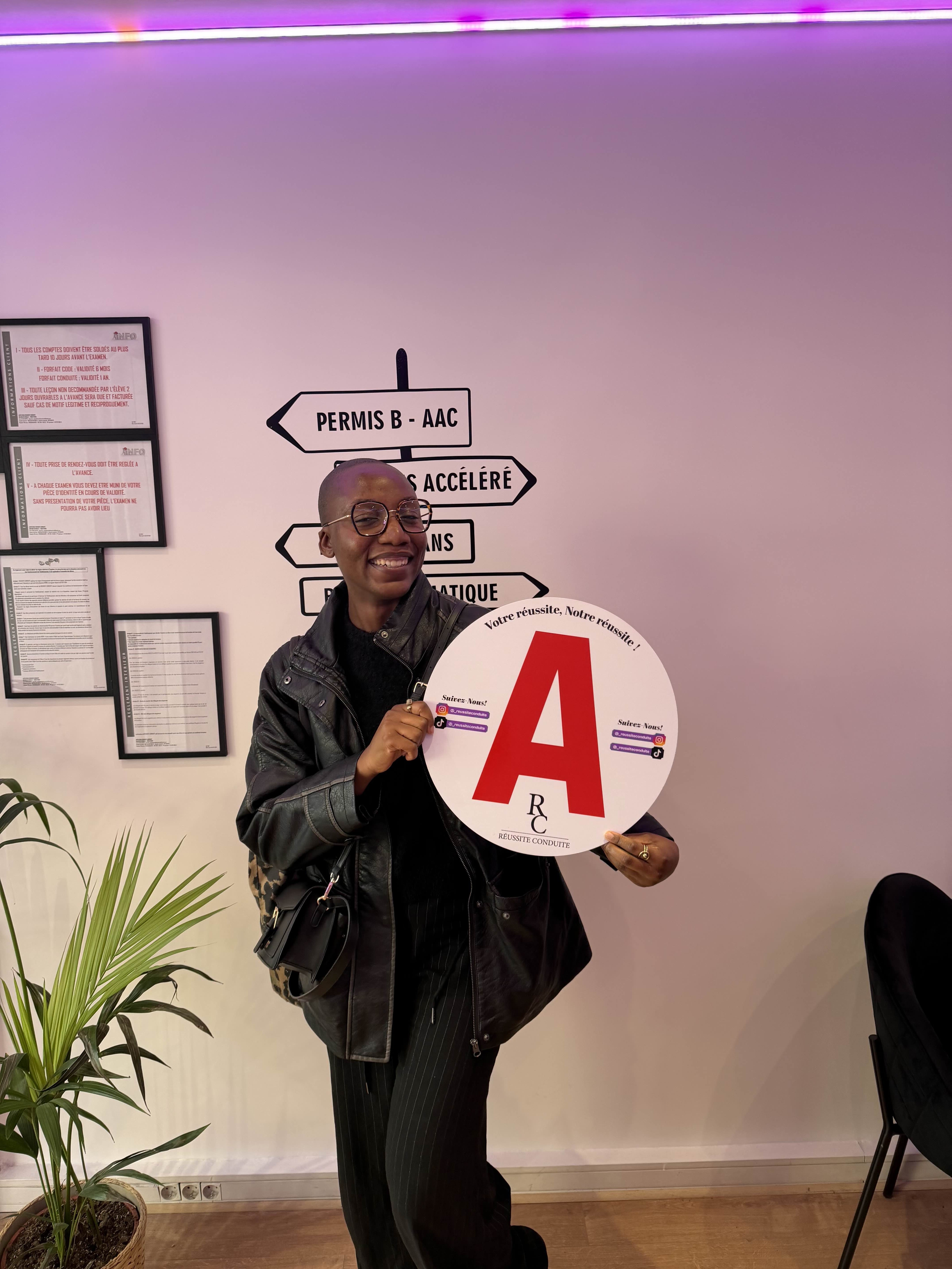 man in black jacket holding blue tablet computer
