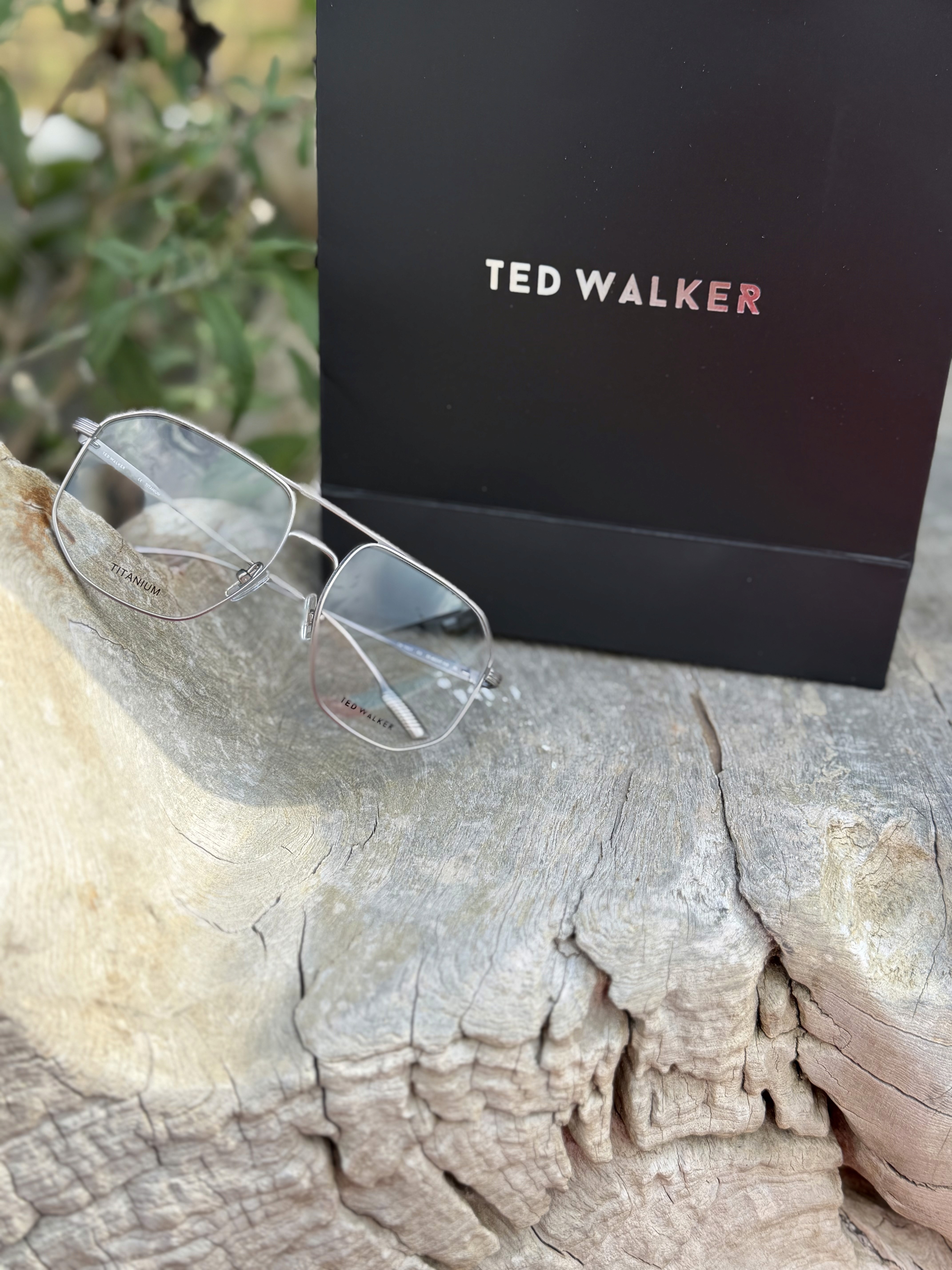 black framed eyeglasses on white surface