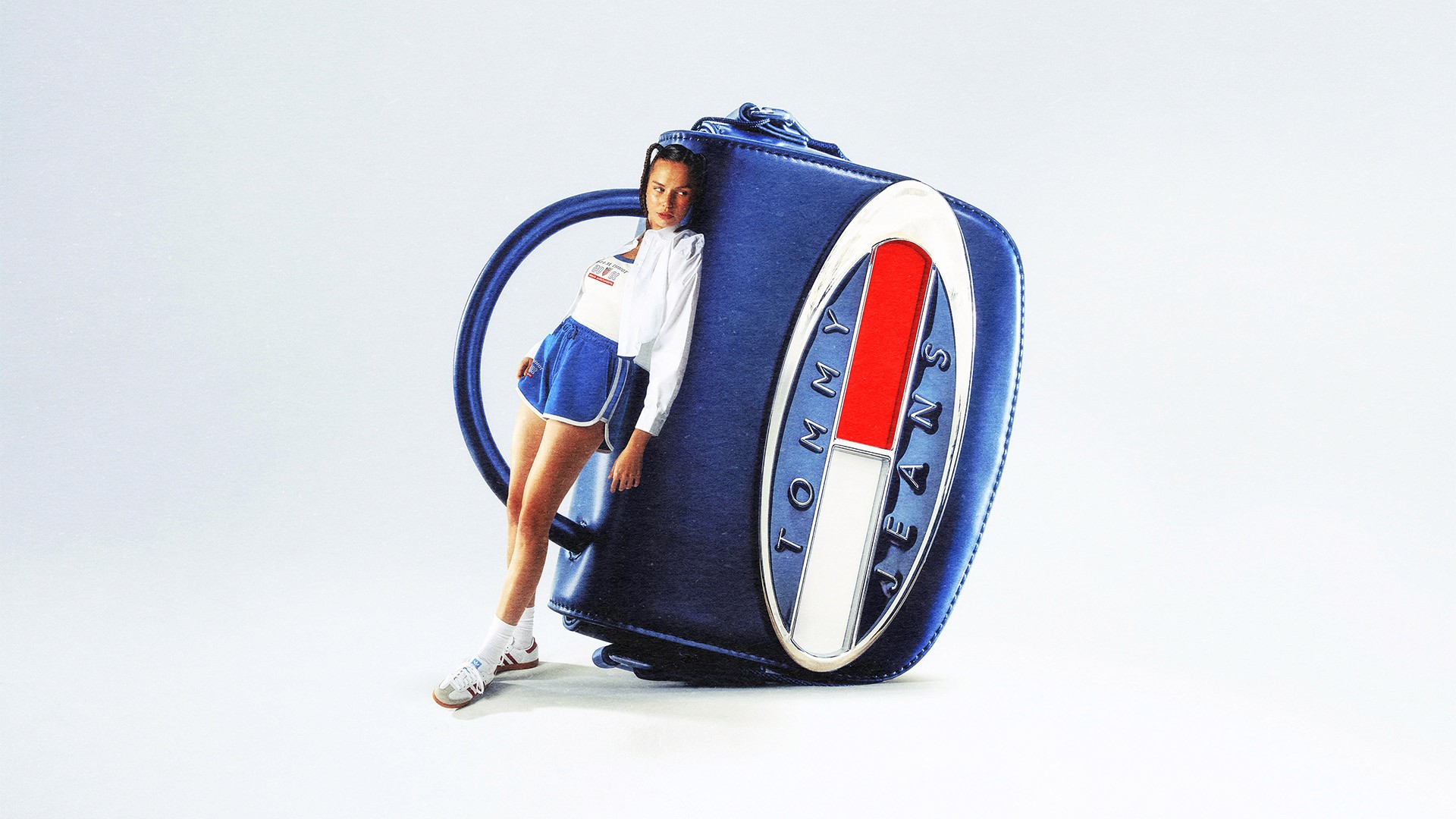 Streetside billboard with flyposters of the Batch.Works brand and illustrations