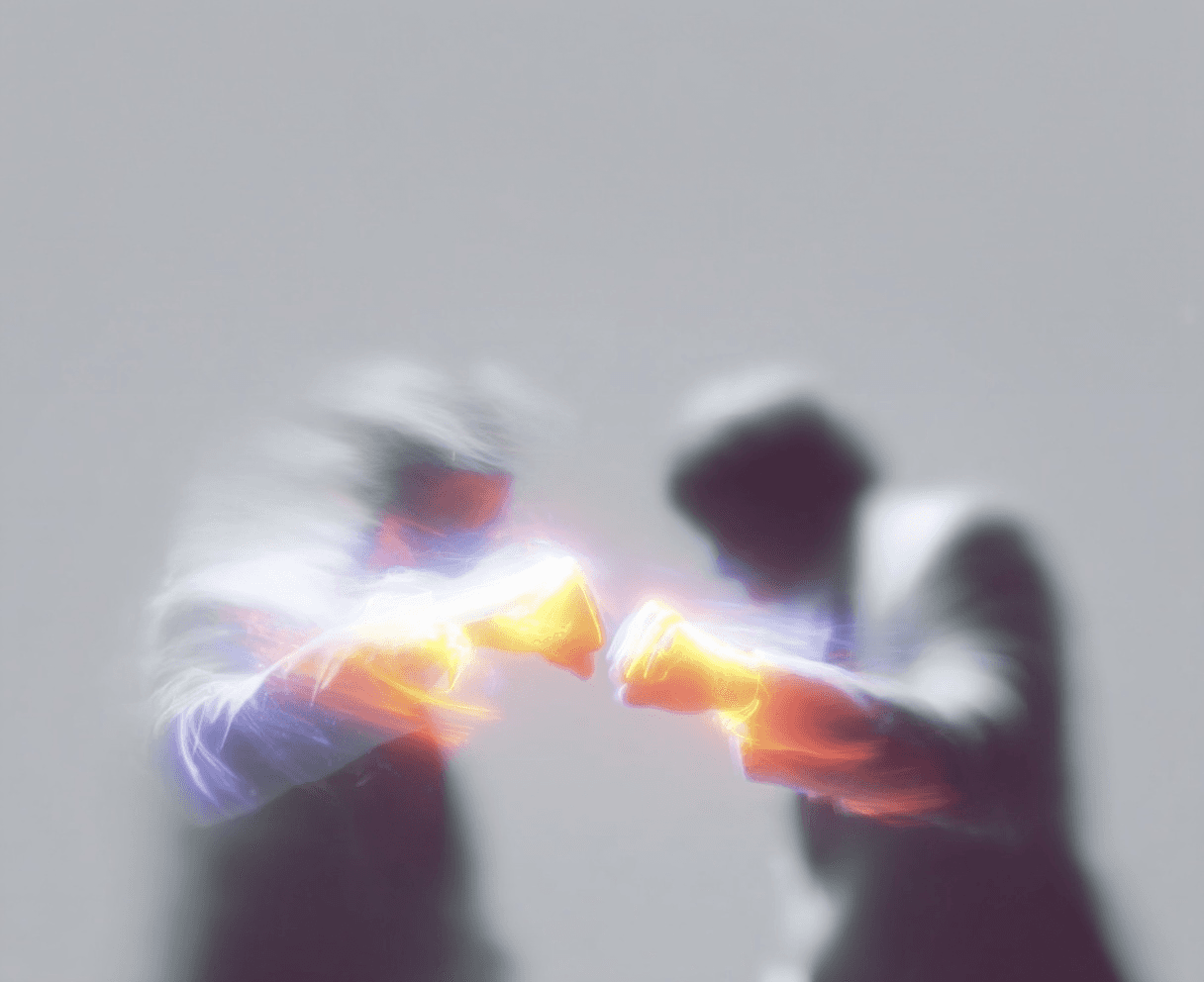 Two blurry figures in suits bump glowing golden fists, creating an energetic burst of light on a grey background.
