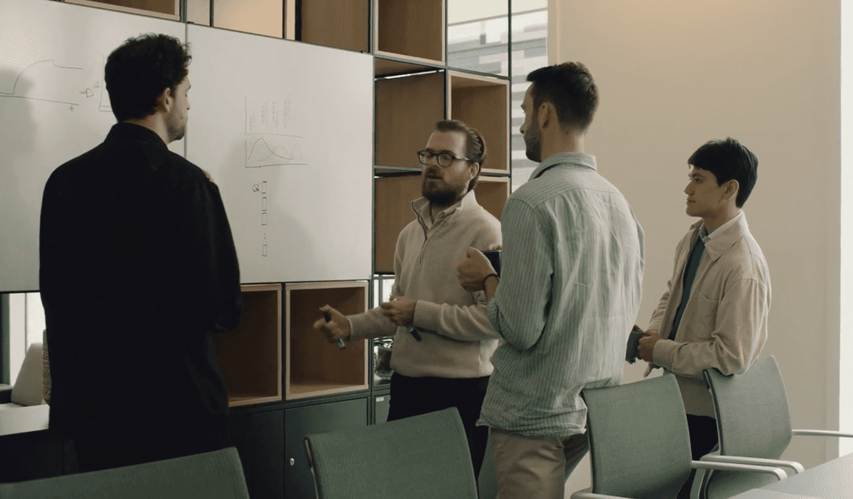 Close-up of hands holding a petri dish with visible samples, in a lab setting with soft golden lighting and scientific tools in the background.