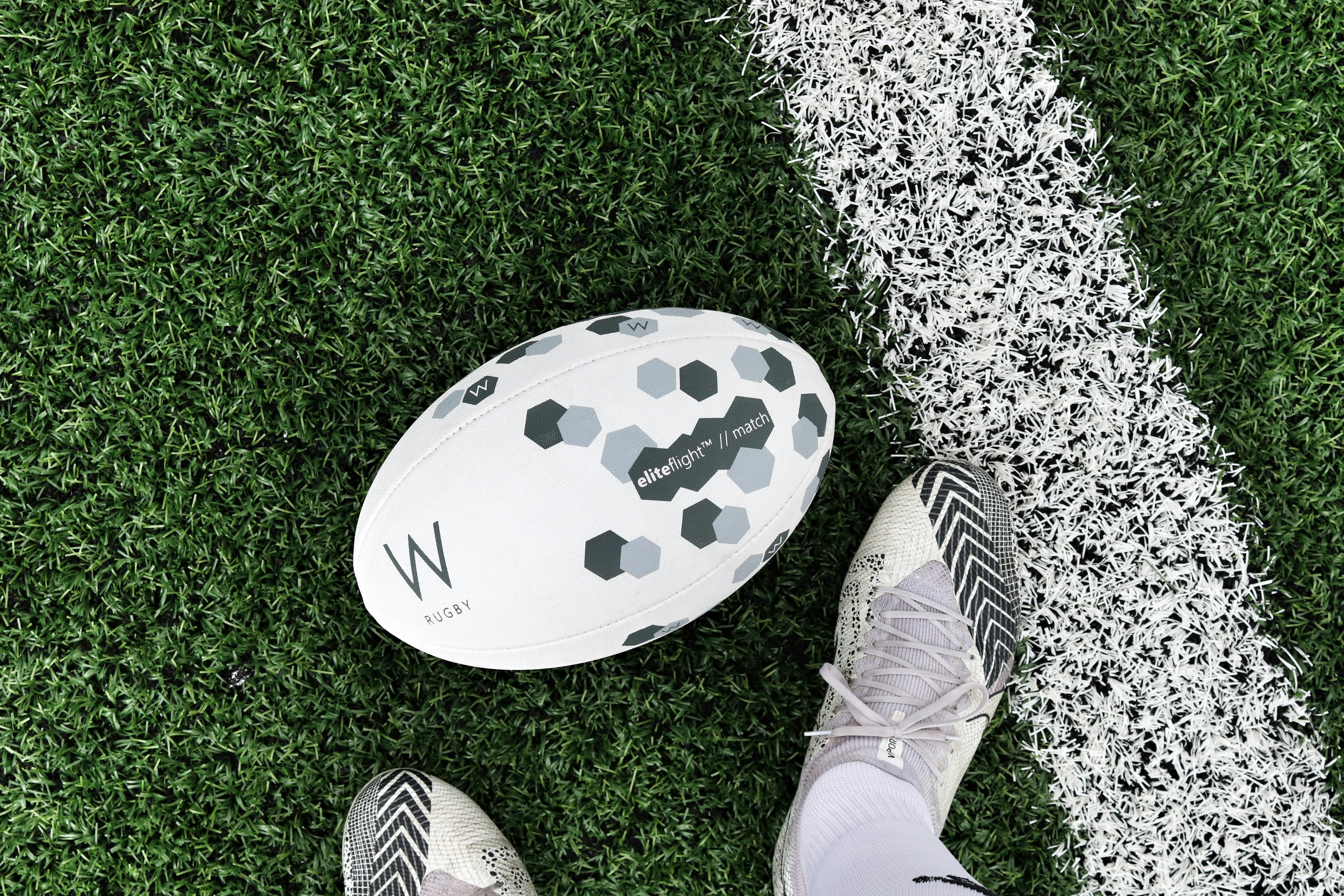A rugby ball laying in the field