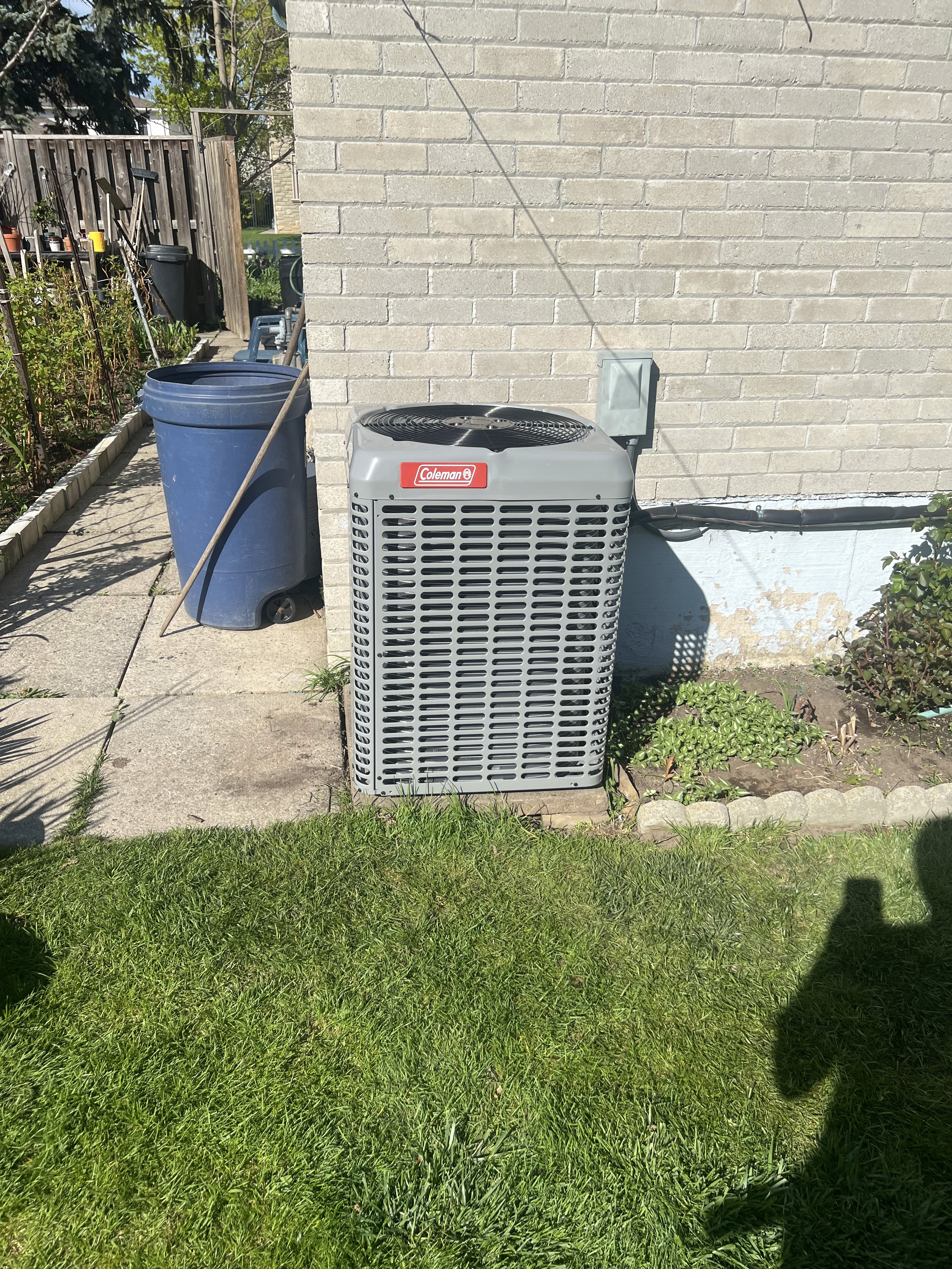 Outdoor AC unit installed at a Toronto home for residential cooling
