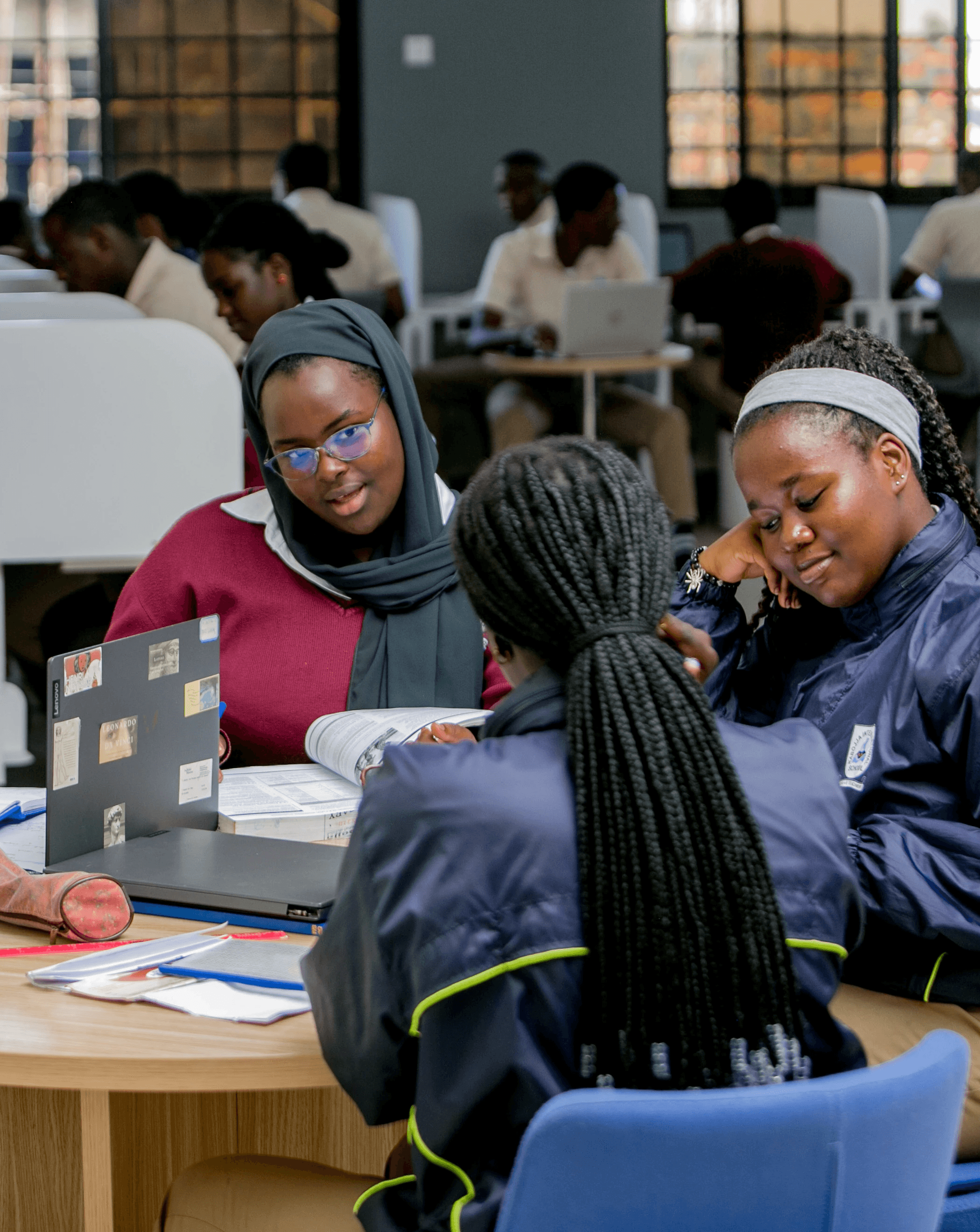 A vintage school bus is driving down the road