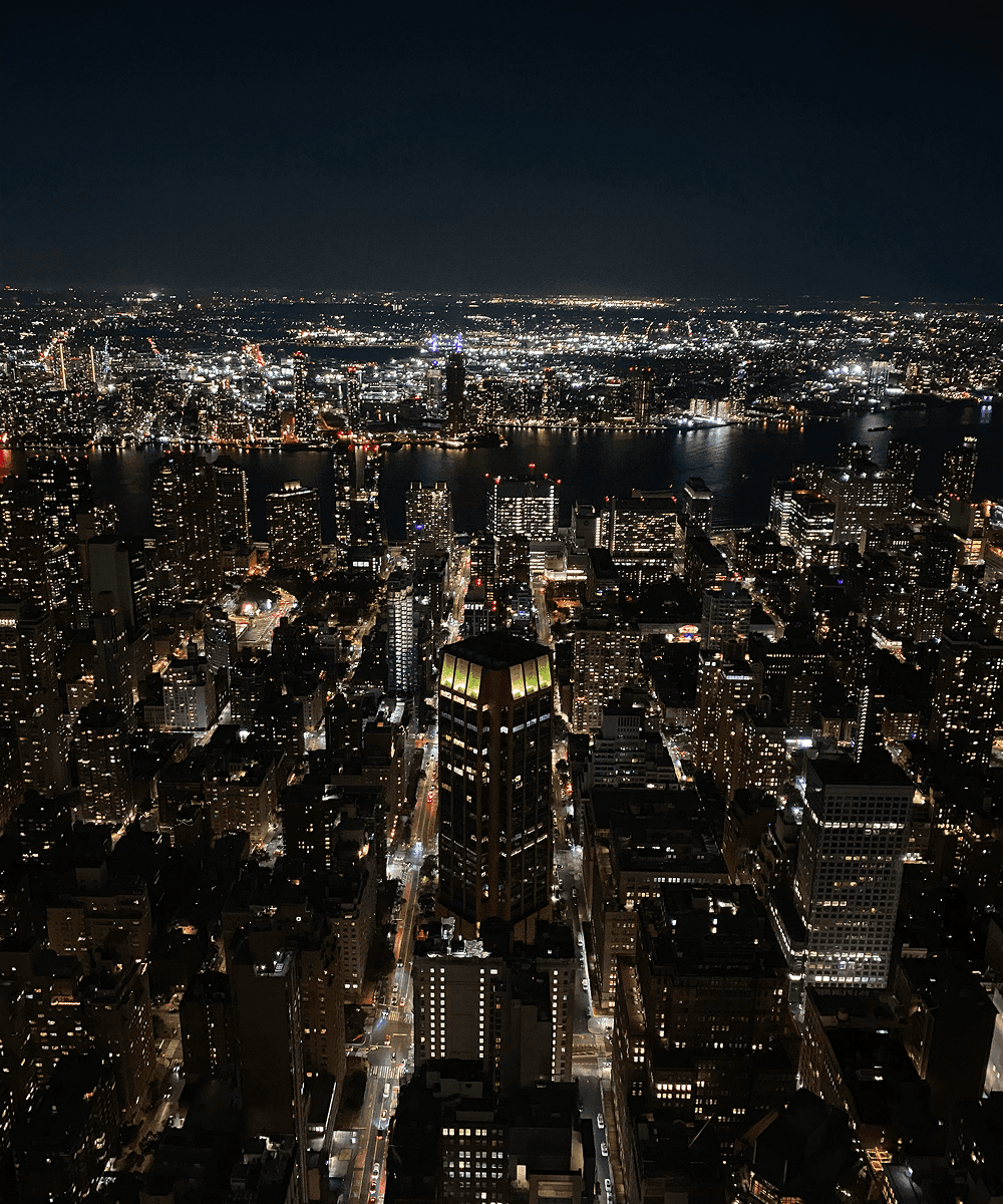 A view of New York City at night from the Empire State Building