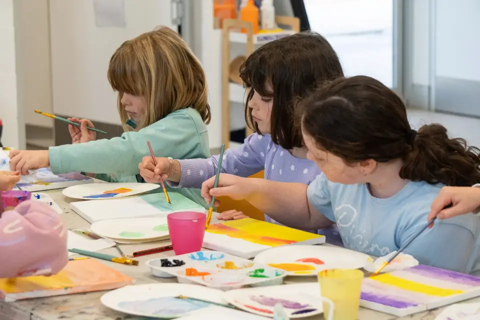 Children painting on a canvas