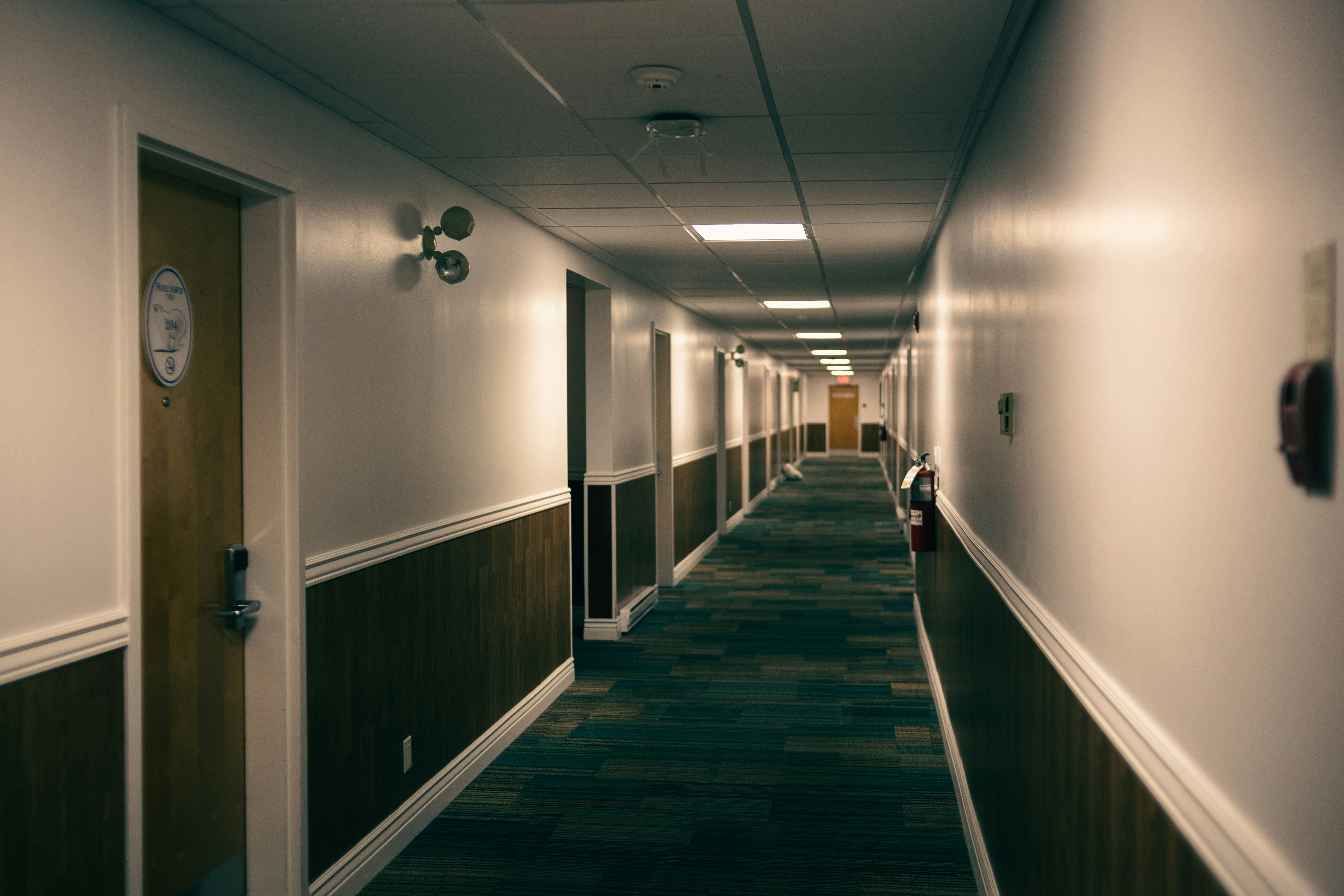 a long hallway with a clock on the wall