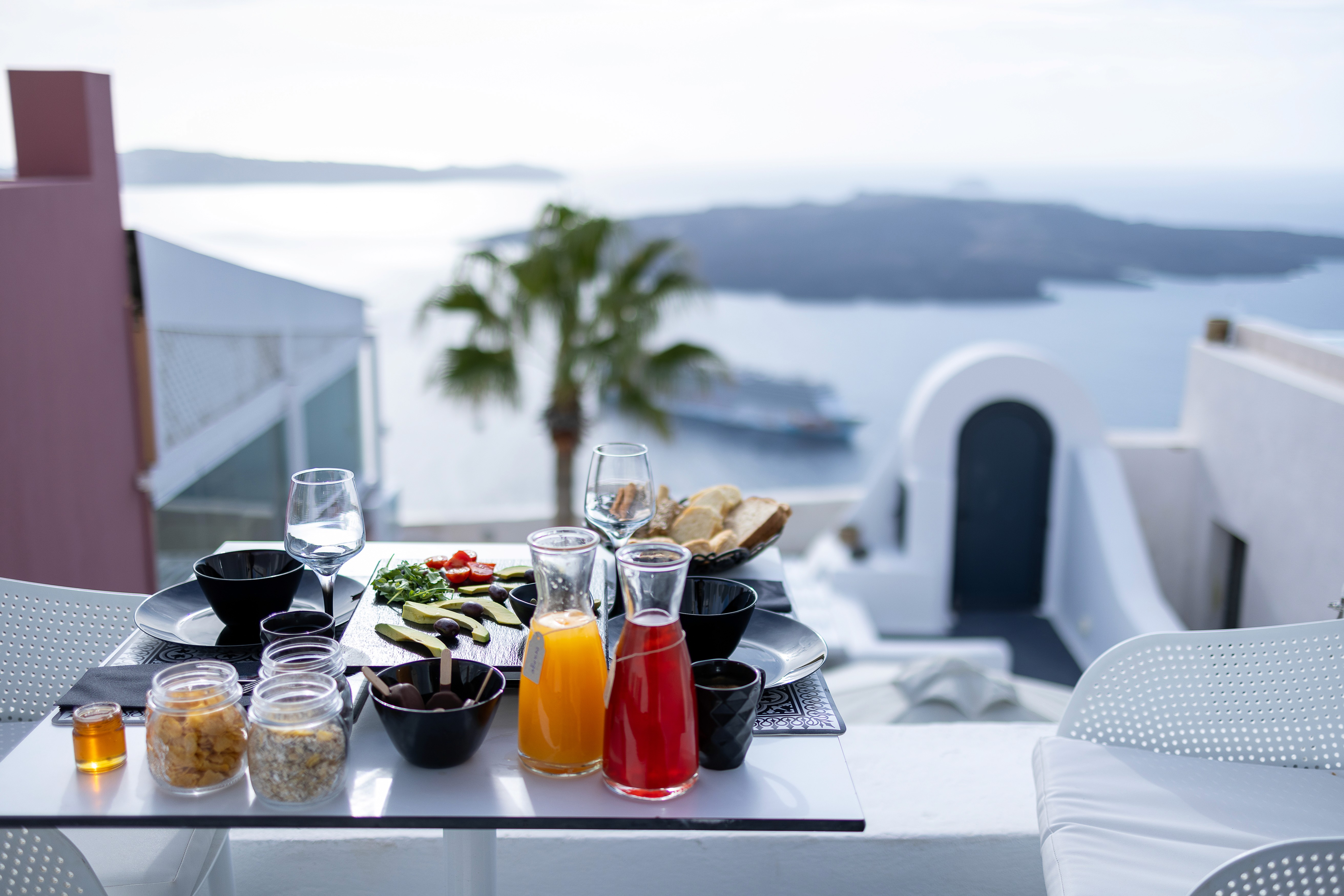 Breakfast at our Villas balcony with panoramic view of the caldera