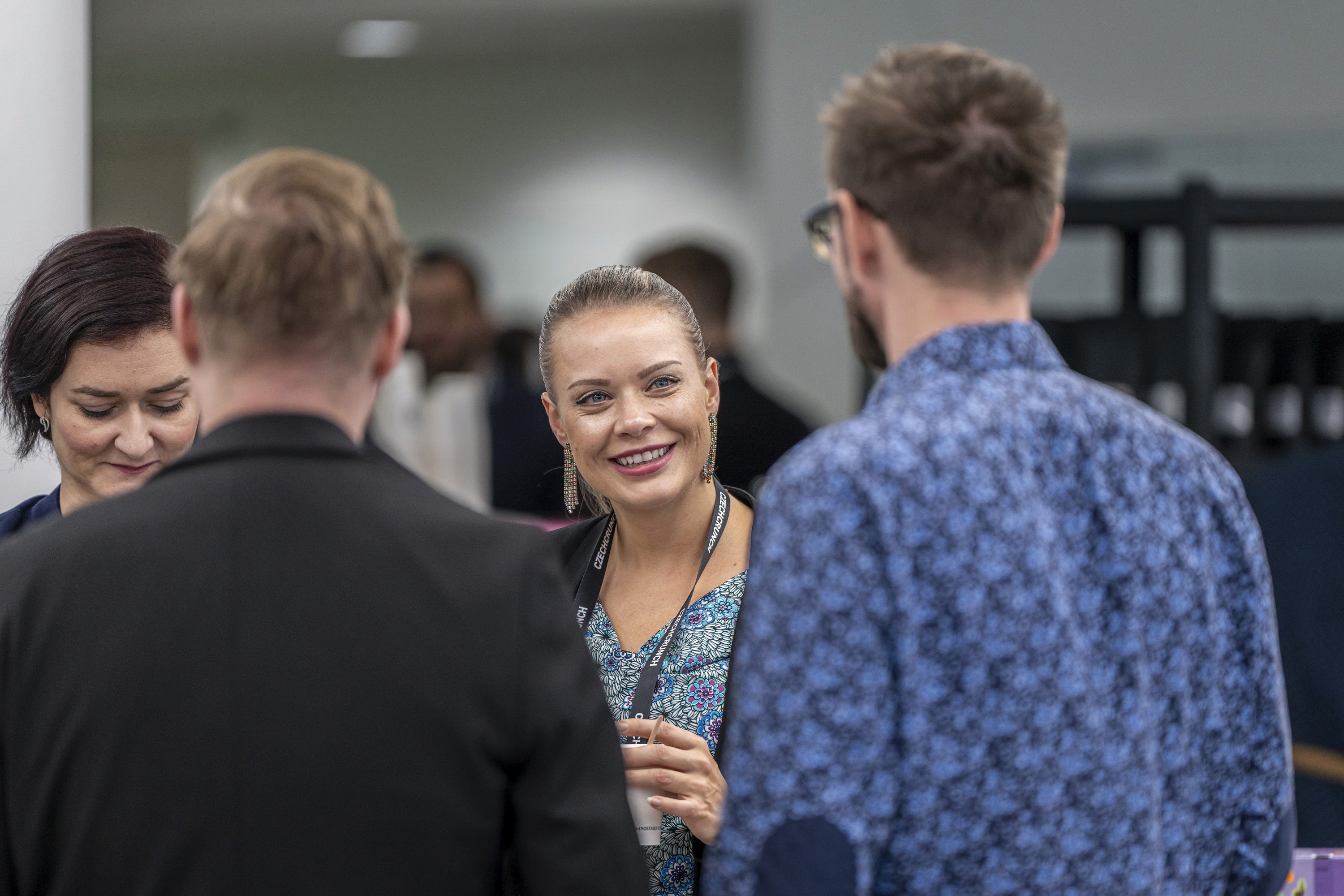 Attendees talking during a networking break at a professional conference.