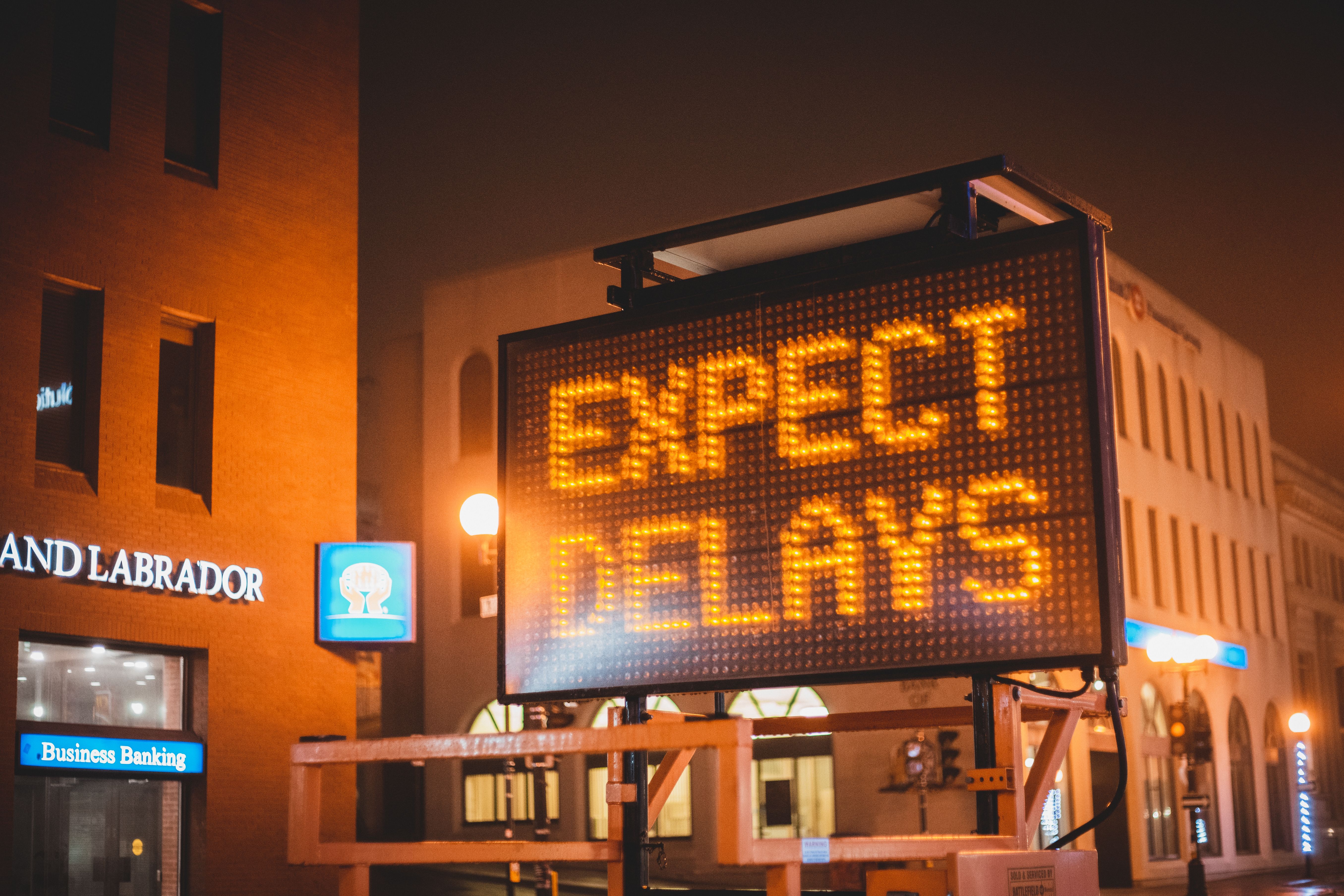 mobile-electronic-traffic-sign-with-inscription-expect-delays-placed-on-road-in- - erik-mclean (pexels)