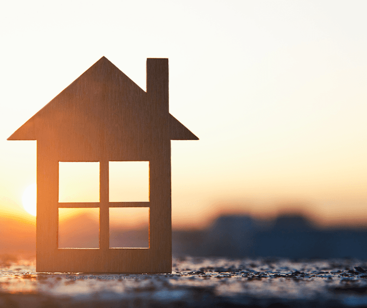 El icon de seguros de casas en el atardecer