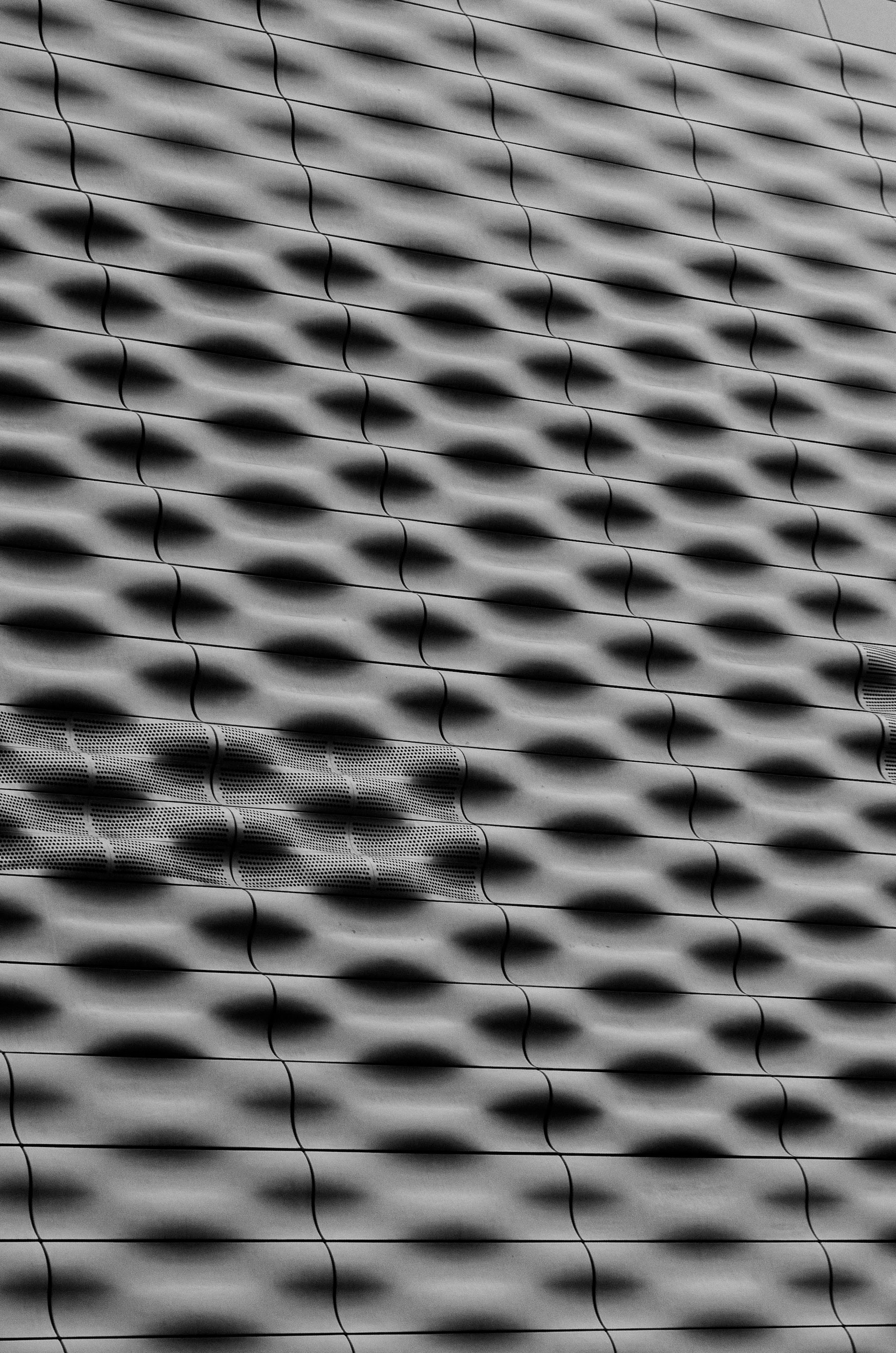 Abstract pattern of light and shadow on textured surface