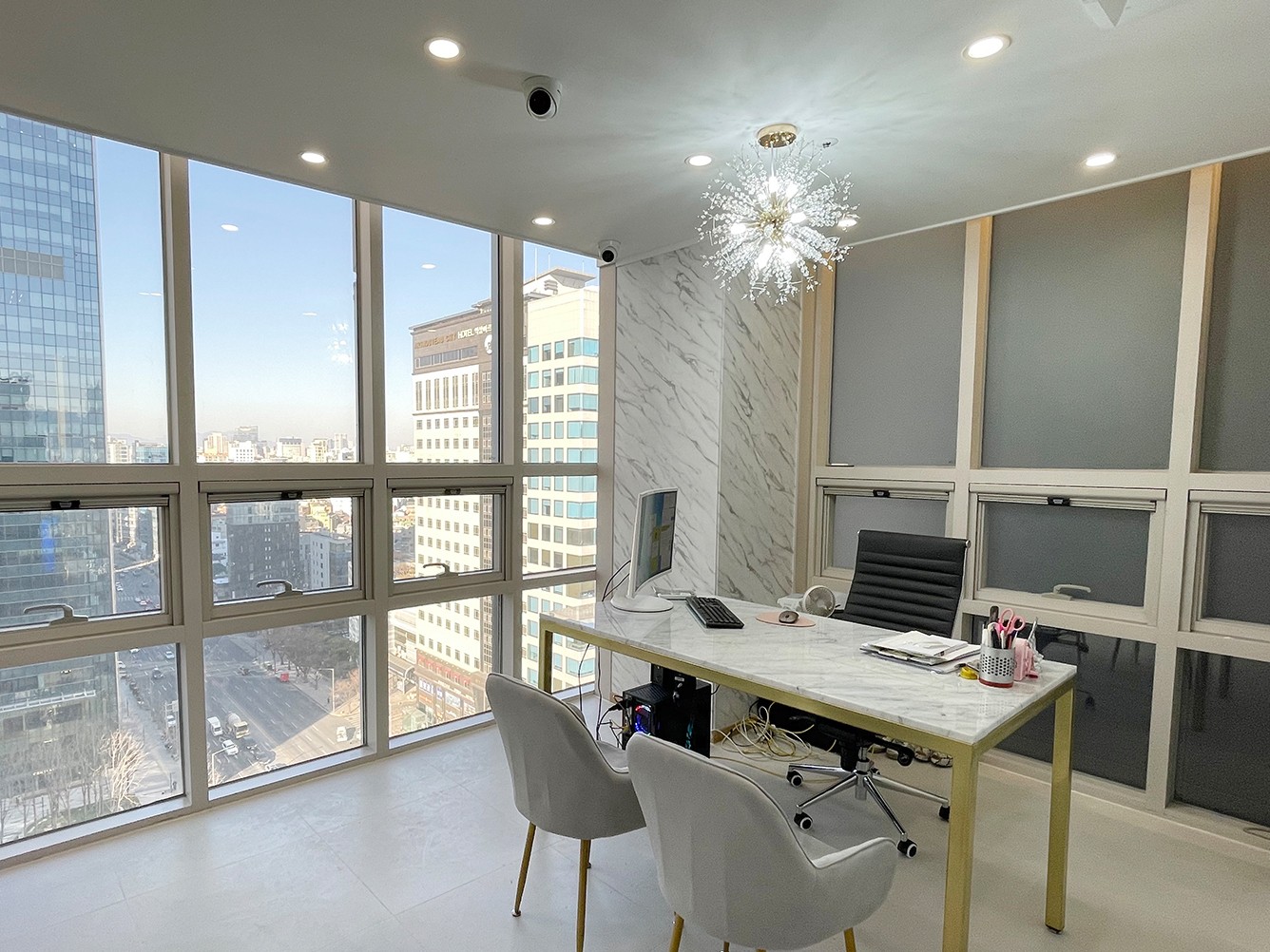woman with brown hair and wearing silver necklace