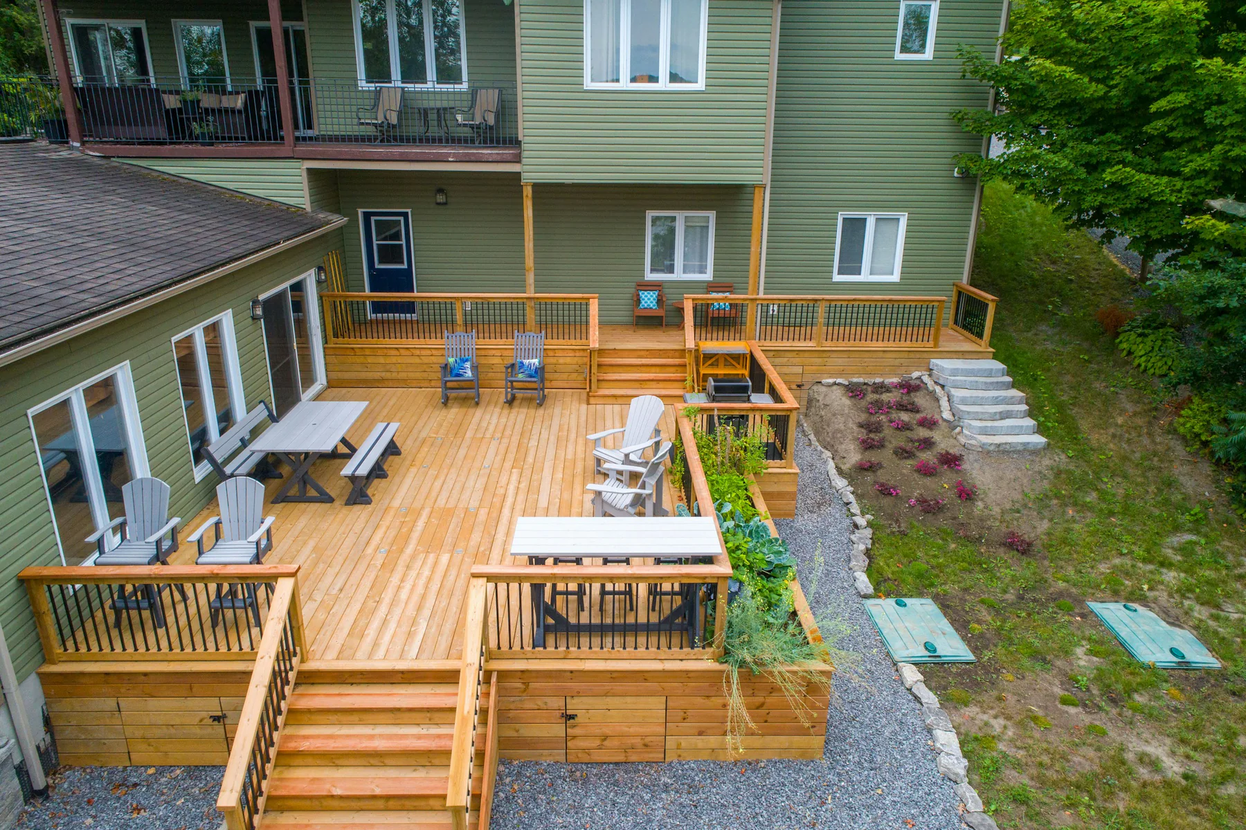 Cedar deck with stairs, railings, and outdoor seating