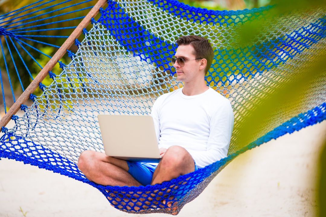 Person seated with laptop