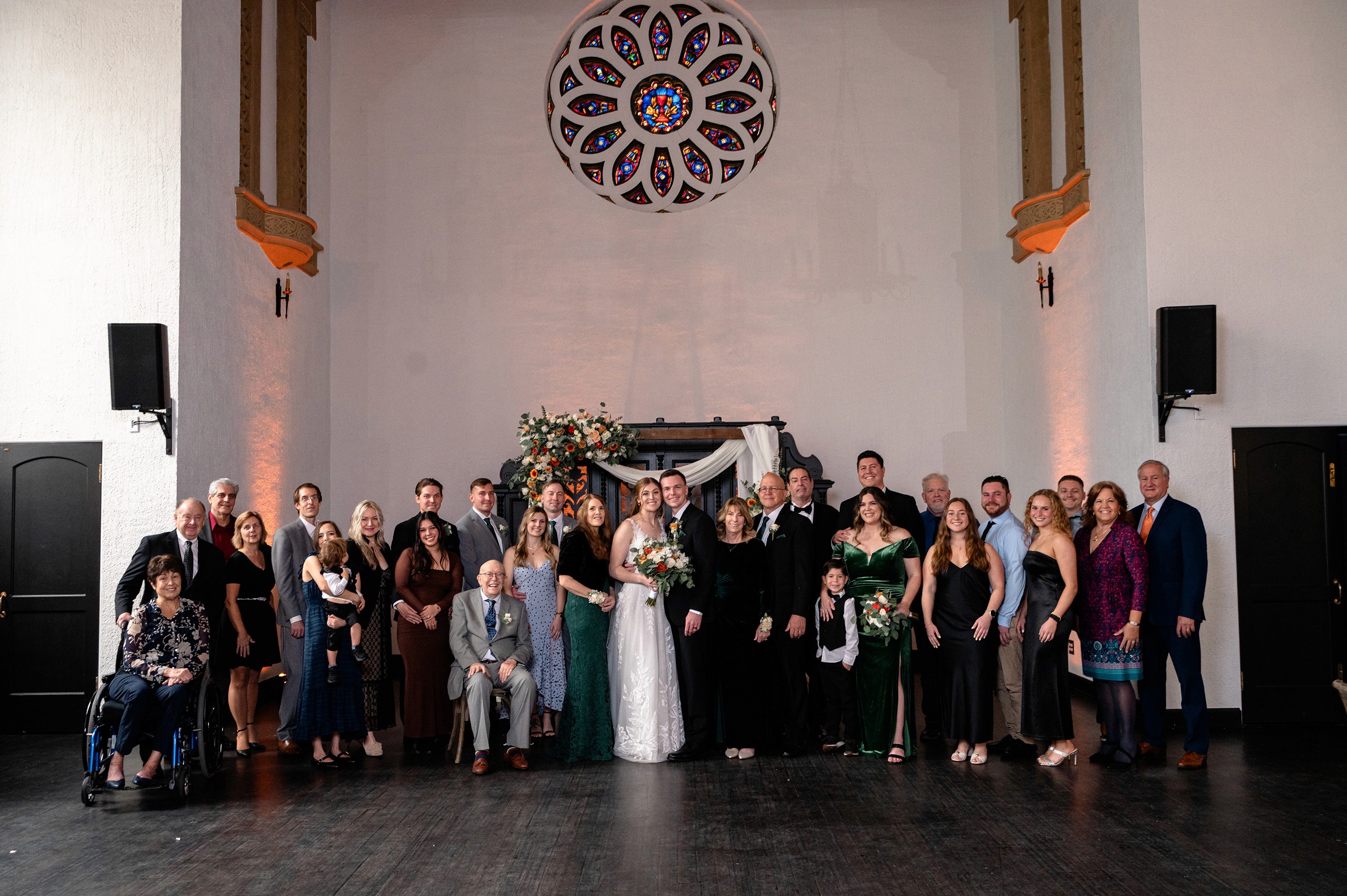 Flat lay wedding details with bouquet, rings, and sparkling bridal heels