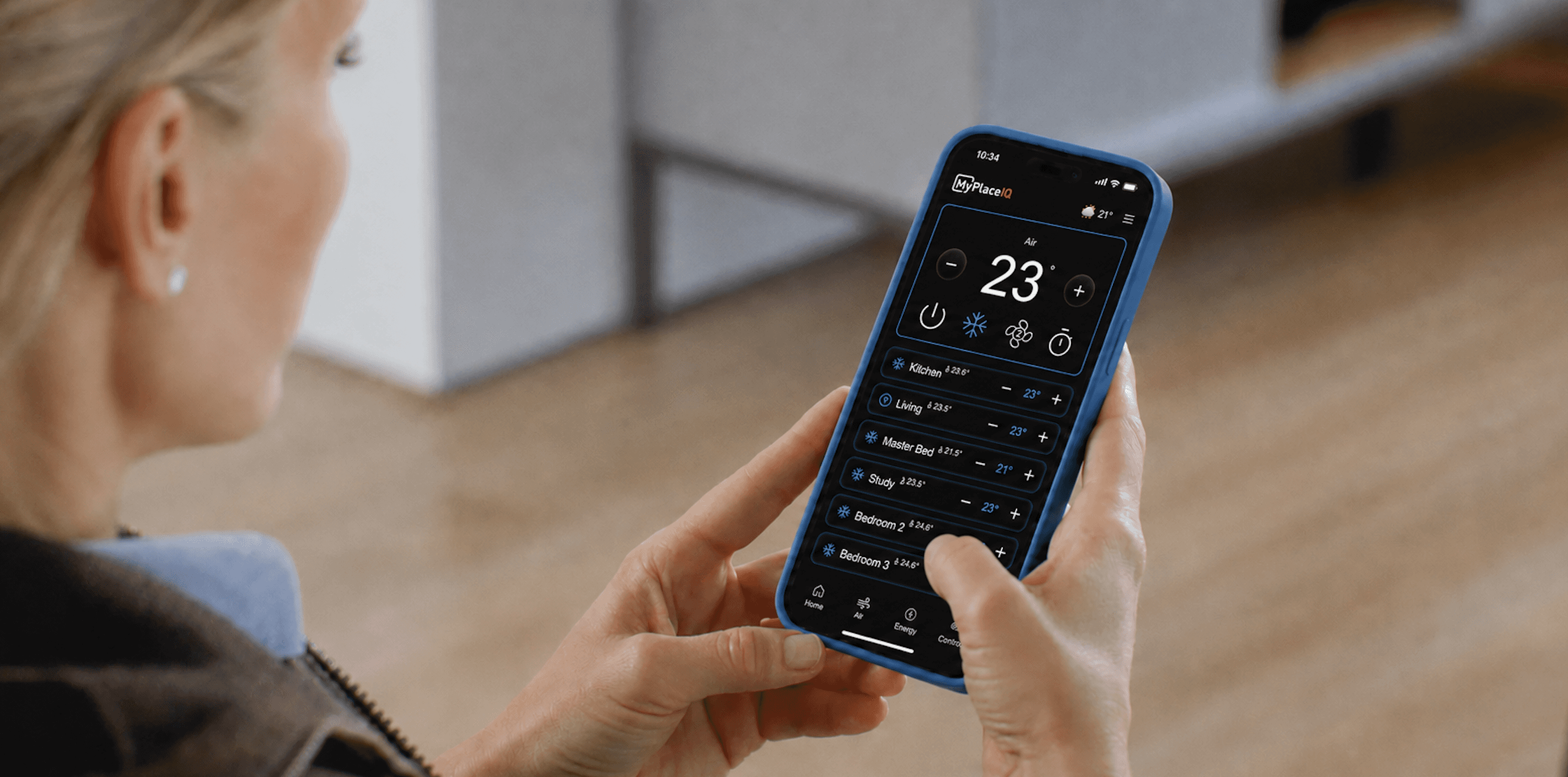 A woman using a smart phone with MyPlaceIQ app