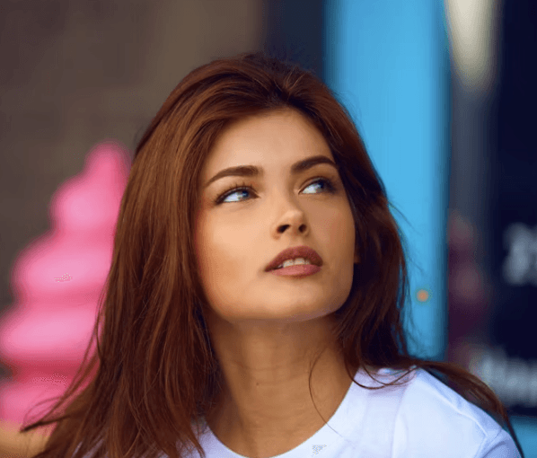 a man with a goatee smiles at the camera