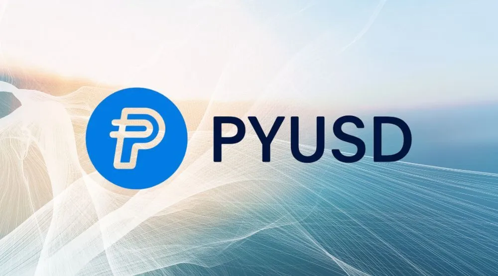 Blaues Logo mit stilisiertem „P“ neben dem Schriftzug „PYUSD“ auf hellem, abstraktem Hintergrund mit weißen und blauen Verlaufslinien.