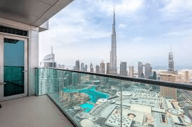 Man running on a winding path through desert badlands.