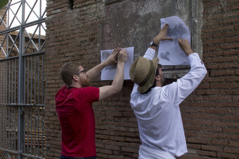 two man making paper trace