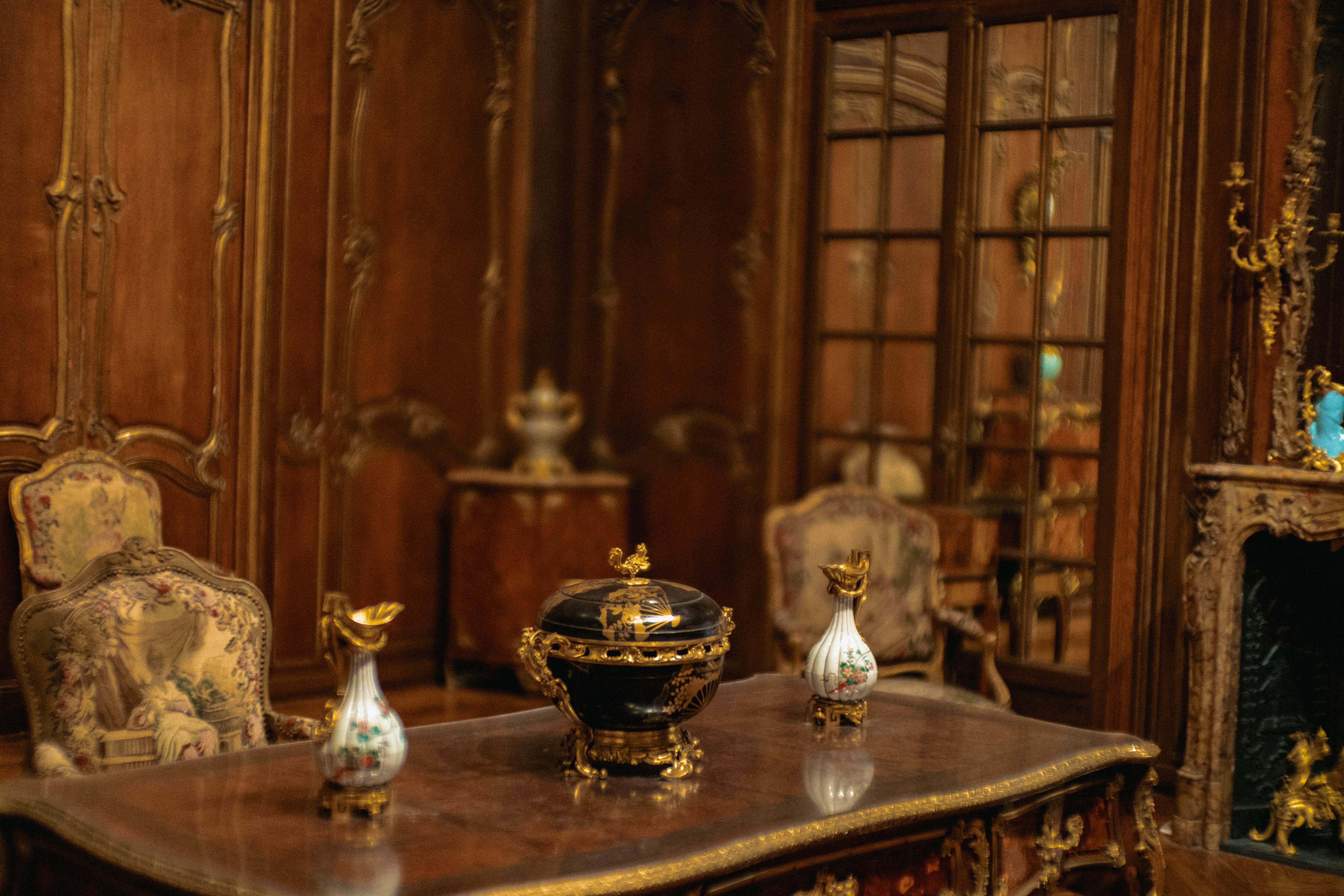 Traditional items arranged on a table inside a traditional-style room.