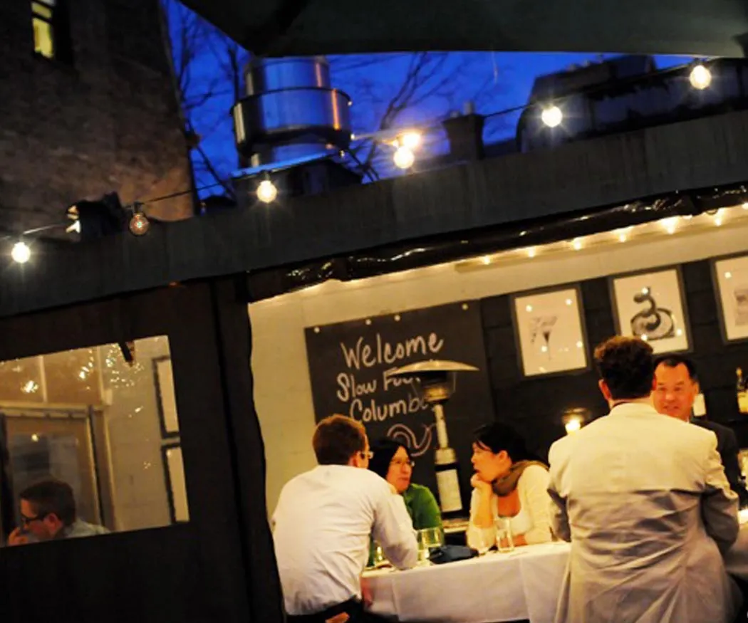 Terrace tables at night at Basi Italia