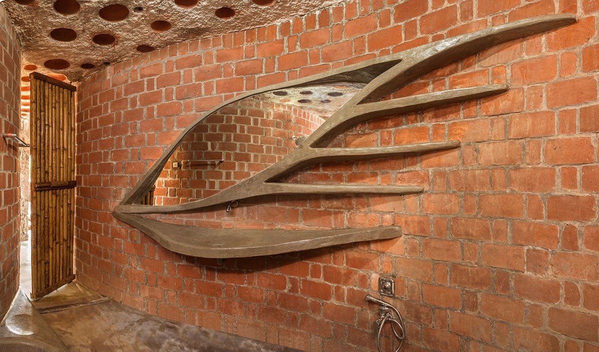 Brick house built using rat trap bond brick work