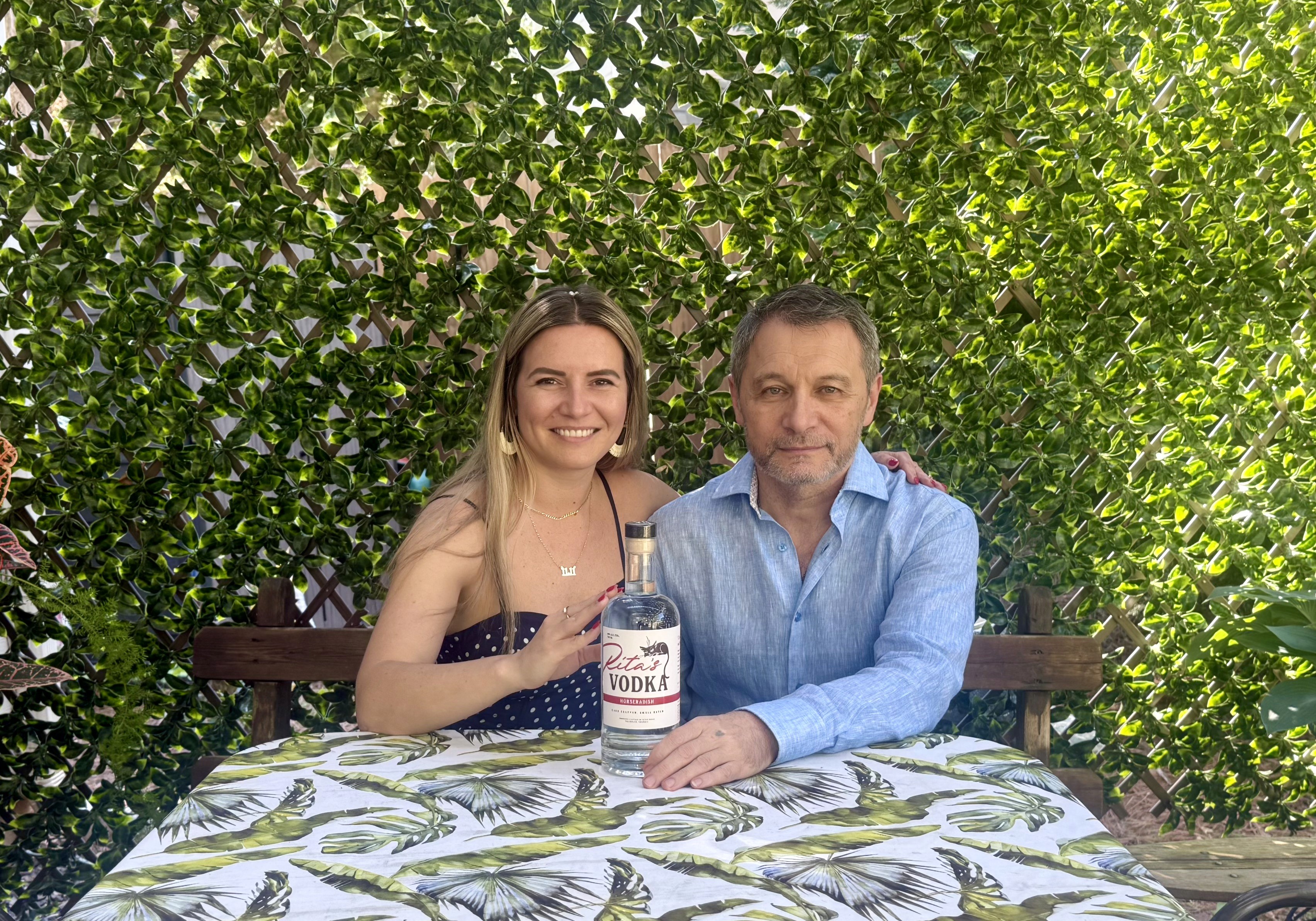 person standing on cliff painting