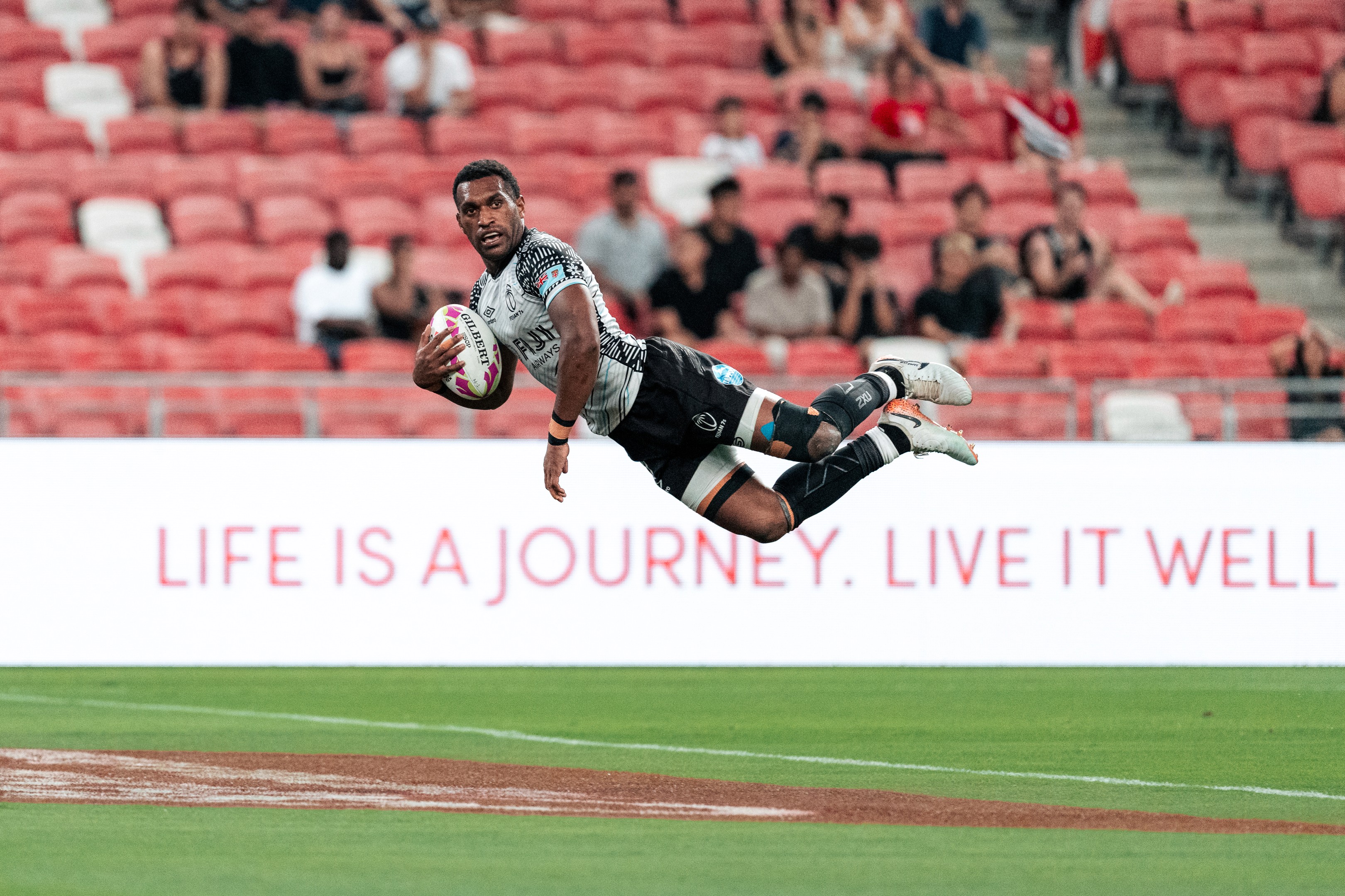 Joji Nasova of Fiji goes for a try during a match at the HSBC SVNS Singapore 2025